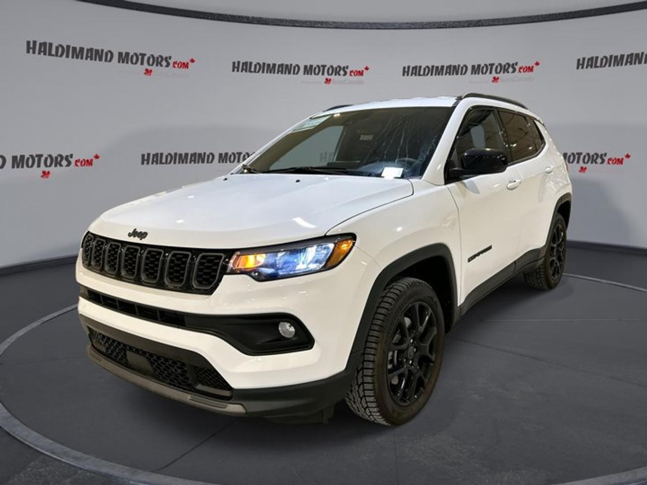 // ACCIDENT FREE!! //<br /><br />This used 2025 Jeep Compass Altitude 4x4 | Leather Seats | Heated Steering is ready for life in Cayuga with sharp style, smart features, and low kilometres. With only 7,029 km, a White exterior, Black interior, four doors, and an automatic transmission, this SUV offers a confident and refined daily drive.<br /><br />Powered by a 2.0-litre gas engine, this 2025 Jeep Compass Altitude 4x4 | Leather Seats | Heated Steering delivers solid response and year-round traction through Four-Wheel Drive. It blends easy city handling with the confidence drivers want for changing Ontario weather, while its clean design and useful equipment add strong everyday appeal.<br /><br />FEATURES OF THE Compass Altitude 4x4 | Leather Seats | Heated Steering<br /><br />   Four-Wheel Drive for all-season road confidence<br />   Heated steering wheel for cold mornings<br />   Leather seats add premium cabin comfort<br />   Navigation system helps guide every trip<br /><br />ADVANCED SAFETY FEATURES<br /><br />   Backup camera helps with tight parking<br />   Lane departure warning adds extra awareness<br />   Adaptive cruise control supports highway driving<br />   Stability control helps keep handling composed<br /><br />The 2025 Jeep Compass Altitude 4x4 | Leather Seats | Heated Steering gives you a reassuring mix of active and passive safety. Anti-Lock Braking System, driver and passenger airbags, side impact airbags, head side airbags, child safety locks, and tire pressure monitoring all help support peace of mind on every trip.<br /><br />PERFORMANCE AND EFFICIENCY<br /><br />   2.0-litre gas engine delivers smooth power<br />   Eight-speed automatic supports refined shifting<br />   Four-Wheel Drive improves traction year-round<br />   Low 7,029 km adds extra appeal<br /><br />This 2025 Jeep Compass Altitude 4x4 | Leather Seats | Heated Steering is built for versatile driving. The automatic transmission with dual shift mode helps provide smooth operation, while power steering supports easy control in town, on rural roads, and during longer highway drives around Ontario.<br /><br />COMFORT AND CONVENIENCE<br /><br />   Heated front seats help beat winter<br />   Remote starter adds everyday convenience<br />   Automatic climate control maintains cabin comfort<br />   Power driver seat supports easy adjustment<br /><br />Inside, the 2025 Jeep Compass Altitude 4x4 | Leather Seats | Heated Steering feels well equipped for daily use. Push button start, power windows, heated mirrors, electric mirrors, front air conditioning, adjustable steering wheel, driver lumbar support, and automatic door locks all help make each drive simple and comfortable.<br /><br />TECHNONOLGY AND CONNECTIVITY<br /><br />   Apple CarPlay keeps apps within reach<br />   Android Auto supports easy smartphone connection<br />   Bluetooth integration enables hands-free communication<br />   WiFi hotspot keeps passengers connected<br /><br />The 2025 Jeep Compass Altitude 4x4 | Leather Seats | Heated Steering also includes a strong tech package for modern drivers. Navigation system, satellite radio, HD Radio, steering wheel audio controls, and illuminated vanity mirrors help create a cabin that feels practical, connected, and ready for busy daily life.<br /><br />CARGO SPACE<br /><br />   Rear trunk access makes loading easier<br />   Four-door layout supports passenger flexibility<br />   Rear spoiler adds sporty utility style<br />   Cabin storage suits daily essentials<br /><br />The 2025 Jeep Compass Altitude 4x4 | Leather Seats | Heated Steering offers useful SUV practicality for groceries, work gear, and weekend bags. Its smart layout makes it easy to load and unload, while the compact exterior size helps with parking and everyday manoeuvrability.<br /><br />WHAT OTHER OWNERS LIKE<br /><br />   User-friendly infotainment and phone connectivity<br />   Comfortable ride for daily commuting<br />   Confident winter traction from Four-Wheel Drive<br />   Heated features improve cold-weather comfort<br /><br />Finished in White with a Black interior, this 2025 Jeep Compass Altitude 4x4 | Leather Seats | Heated Steering stands out with LED headlamps, fog lights, tinted windows, ambient lighting, and automatic headlights. It is a well-rounded used SUV with the comfort, safety, and technology many drivers want from a modern Jeep.<br /><br />This 2025 Jeep Compass Altitude 4x4 | Leather Seats | Heated Steerings VIN is: 3C4NJDFN9ST606335.<br /><br />WHY CHOOSE US? <br /><br />Honest & Transparent Buying Experience: Weve been a trusted name in business since 1984.<br /><br />STRAIGHTFORWARD PRICING:<br />Our Advertised Price Includes:<br />>>Safety Certification (No separate fee!)<br />>>30-Day 100% Mechanical Warranty<br />>>FREE Carfax History Report.<br />>>No upcharge for paying cash.<br />(Prices Exclude HST and Licensing Fees only.)<br /><br />>>Browse 300+ vehicles all in ONE LOCATION<br /><br />EASY FINANCING: Great rates & open loans<br /><br />WE BUY CARS: Get Top Dollar for your trade-in, or sell us your vehicle for CASH! Even if you dont buy from us!<br /><br />STOP BY TODAY<br />Treat yourself - stop by Haldimand Motors Ltd. located at 42 Talbot St E, Cayuga, ON N0A 1E0 to make this car yours today!<br /><br />https://www.haldimandmotors.com/used/stock-460224.html