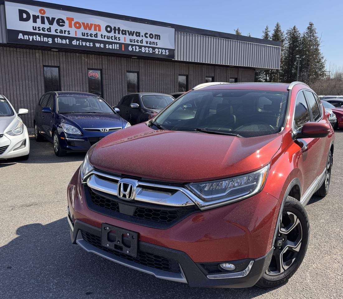 <p data-start=0 data-end=647>2018 HONDA CR-V TOURING AWD &ndash; PREMIUM, RELIABLE & ALL-WEATHER CONFIDENT!<br data-start=72 data-end=75>LIKE NEW &ndash; LEGENDARY HONDA QUALITY, SMOOTH DRIVE & EXCELLENT FUEL EFFICIENCY!<br data-start=152 data-end=155 data-is-only-node=>1.5L TURBO I4 ENGINE + CVT + AWD &ndash; POWERFUL, QUIET & BUILT FOR LONG-TERM RELIABILITY IN ALL CONDITIONS!<br data-start=258 data-end=261>TOURING TRIM FULLY LOADED WITH TOP-TIER FEATURES: HEATED LEATHER SEATS, PANORAMIC SUNROOF, NAVIGATION, BACKUP CAMERA, LANEWATCH SIDE CAMERA, ADAPTIVE CRUISE CONTROL, BLUETOOTH, TOUCHSCREEN DISPLAY, APPLE CARPLAY/ANDROID AUTO, KEYLESS ENTRY & PUSH-BUTTON START!<br data-start=521 data-end=524>PERFECT FOR FAMILIES, COMMUTERS OR YEAR-ROUND DRIVING &ndash; SAFE, SPACIOUS, LUXURIOUS & DEPENDABLE!<br data-start=619 data-end=622>EASY FINANCING AVAILABLE!</p><p data-start=649 data-end=686>ADVERTISED PRICE IS OUR FINANCE PRICE</p><p data-start=688 data-end=897 data-is-last-node= data-is-only-node=>DRIVETOWNOTTAWA.COM &ndash; COME VISIT US / VENEZ NOUS VISITER!<br data-start=745 data-end=748>TAXES AND LICENSING EXTRA. SEE DRIVETOWNOTTAWA.COM FOR CASH PRICE FINANCING CHARGES APPLY (BANK FEES, PPSA, INTEREST). QUEBEC SAFETY FEE APPLICABLE.</p>