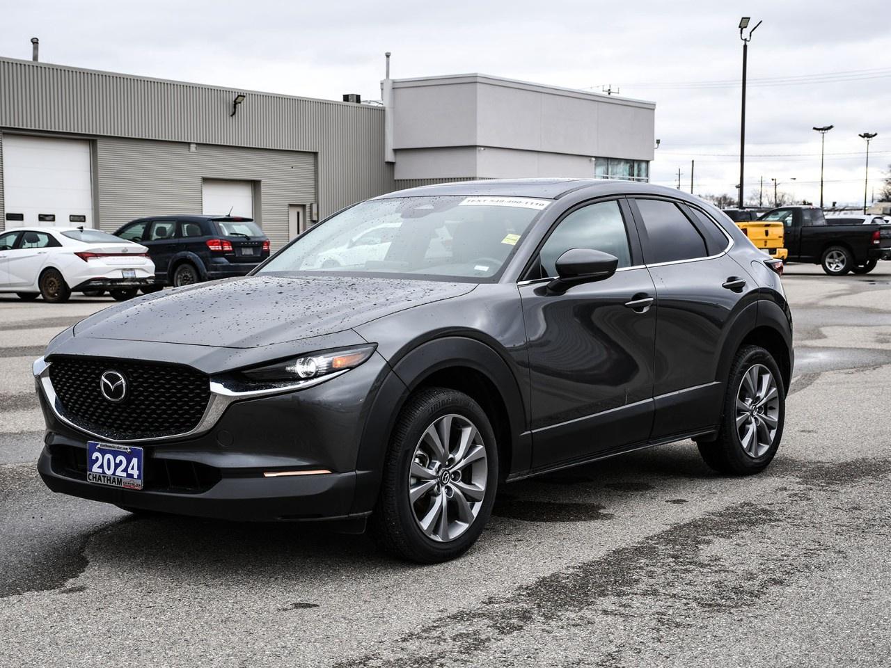 Meet Vivienne.<br /><br />A 2024 Mazda CX-30 GS with the Luxury Package in Grey, with 72,692km's and a story as polished as her design. A former daily rental, Vivienne has been well-traveled, reliable, and now shes ready for a permanent home where her mix of refinement, comfort, and practicality can truly shine.<br /><br />Vivienne is the kind of vehicle that makes every drive feel effortless. Compact enough for city life yet confident on winding roads, her AWD system and responsive 2.0L I4 paired with a 6-speed automatic transmission give her a smooth, composed ride in all conditions.<br /><br />The Luxury Package adds premium touches that make every journey feel special:<br /> Heated front seats with 3 settings & heated steering wheel<br /> 10-way power adjustable drivers seat with memory<br /> Leatherette-trimmed upholstery & leather steering wheel<br /> Power-operated glass moonroof with interior sunshade<br /> 18''' Silver Metallic alloy wheels<br /><br />Inside, Vivienne keeps you connected and comfortable:<br /> Apple CarPlay & Android Auto via Mazda AppLink<br /> AM/FM/HD radio with navigation-ready setup<br /> Dual-zone automatic climate control<br /> Steering wheel-mounted audio controls<br /> Rear window wiper & exterior mirrors with reverse tilt-down function<br /><br />Confidence and safety are always a priority:<br /> Electronic stability control & traction control<br /> Rearview camera & brake assist<br /> Auto high-beam headlights & rain-sensing wipers<br /> Emergency communication system via Mazda Connected Services<br /><br />Finished in sleek Grey with a design that balances elegance and sporty appeal, Vivienne is a versatile SUV with personality, style, and reliabilityready to make every drive enjoyable.<br /><br />If youre looking for a luxury-leaning compact SUV thats refined, fun, and full of character, Vivienne is ready to meet.<br /><br />Here at Chatham Chrysler, our Financial Services Department is dedicated to offering the service that you deserve. We are experienced with all levels of credit and are looking forward to sitting down with you. Chatham Chrysler Proudly serves customers from London, Ridgetown, Thamesville, Wallaceburg, Chatham, Tilbury, Essex, LaSalle, Amherstburg and Windsor with no distance being ever too far! At Chatham Chrysler, WE CAN DO IT!