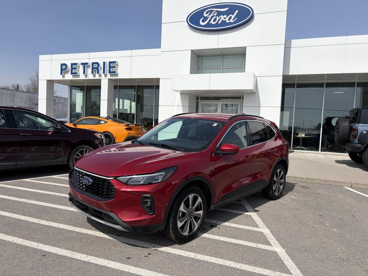 Ready Set Ford! Here is a 2024 Ford Escape Platinum. Powered by a 2.0L ecoboost engine with an 8-speed automatic transmission that delivers impressive performance and smooth handling. The 2024 Ford Escape Platinum features comfortable seating, modern tech features and prioritizes safety. Adventure is calling, come check out the 2024 Ford Escape Platinum today! Key Features: >> Equipment group 601A >> Wireless charging pad >> 360-degree camera >> 13.2 LCD touchscreen >> Heated steering wheel >> Universal garage door opener >> Roof rails >> Remote vehicle start >> Rear spoiler >> Lane keeping system >> Intell access with push start >> Illuminated entry >> Safety canopy >> Tire pressure monitoring system >> Power folding and heated mirrors >> Selectable drive modes >> FORDPASS CONNECT and so much more! *This vehicle was originally registered in Quebec and was a daily rental* This 2024 Ford Escape Platinum is available now at Petrie Ford. We are located at 1388 Bath Road in Kingston, Ontario. Come schedule a test drive today!<p>Ready Set Ford! Here is a 2024 Ford Escape Platinum. Powered by a 2.0L ecoboost engine with an 8-speed automatic transmission that delivers impressive performance and smooth handling. The 2024 Ford Escape Platinum features comfortable seating</p>
<p> come check out the 2024 Ford Escape Platinum today! Key Features: >> Equipment group 601A >> Wireless charging pad >> 360-degree camera >> 13.2 LCD touchscreen >> Heated steering wheel >> Universal garage door opener >> Roof rails >> Remote vehicle start >> Rear spoiler >> Lane keeping system >> Intell access with push start >> Illuminated entry >> Safety canopy >> Tire pressure monitoring system >> Power folding and heated mirrors >> Selectable drive modes >> FORDPASS CONNECT and so much more! *This vehicle was originally registered in Quebec and was a daily rental* This 2024 Ford Escape Platinum is available now at Petrie Ford. We are located at 1388 Bath Road in Kingston</p>