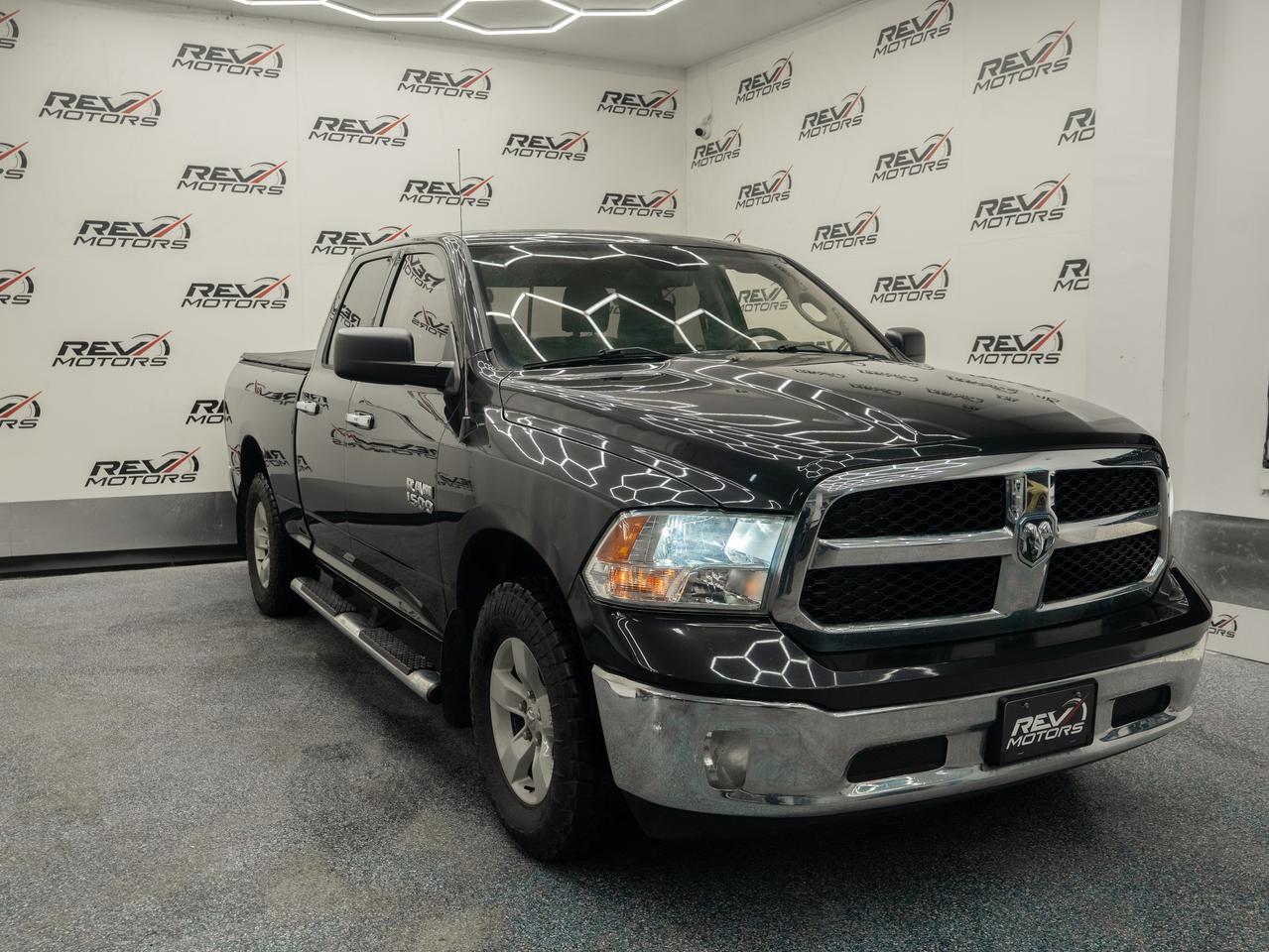 2016 Ram 1500 SLT | Quad Cab | 4X4 | 5 Touch Screen<br/> <br/> Brilliant Black Crystal Pearl Exterior | Black/Grey Cloth Interior | Chrome Grille & Bumpers | 17-Inch Alloy Wheels | Halogen Headlights | Rugged SLT| Rear Sliding Window | 4x4 Drivetrain | 8-Speed Automatic Transmission | Tow/Haul Mode | Class IV Hitch Receiver | Uconnect 5.0 Touchscreen | Bluetooth USB & AUX Connectivity | Voice Command | Steering Wheel Audio Controls | Keyless Entry | Power Windows & Locks | Cruise Control | Quad Cab Seating for Five | 60/40 Split-Folding Rear Bench | Under-Seat Storage | Front & Rear Stabilizer Bars and more. <br/> <br/> <br/> Key Features: <br/> <br/> <br/> Black-on-Black Toughness <br/> The 2016 Ram 1500 SLT stands bold in its Brilliant Black exterior with a matching black interior. Chrome accents, muscular body lines, and the signature Ram grille give it a commanding presence on the road or job site. <br/> <br/> <br/> Comfort Meets Utility <br/> Inside the spacious Quad Cab, youll find comfortable seating for five, smart storage solutions, and a quiet, refined ride. Whether youre commuting, working, or roadtripping, the Ram 1500 SLT balances durability with everyday comfort. <br/> <br/> <br/> Smart, Practical Tech <br/> The Uconnect system keeps you connected with Bluetooth, voice command, and intuitive controls. Steering wheel buttons, available backup camera, and convenient power features make daily driving easier and more enjoyable. <br/> <br/> <br/> Built for Work and Play <br/> With a 64 bed, strong payload capacity, and serious towing capability, this Ram is ready for trailers, tools, toys, and everything in between. The coil-spring rear suspension provides a smoother ride than many trucks in its class. <br/> <br/> <br/> The 2016 Ram 1500 SLT Quad Cab in Black-on-Black blends rugged capability and everyday comfort into a versatile full-size pickup thats ready for work, adventure, and everything in between. Strong, stylish, and dependable  its a truck that delivers. <br/> <br/> <br/> This Vehicle Has Travelled 195,450 Kms. <br/> <br/> <br/> *** NO additional fees except for taxes and licensing! *** <br/> <br/> <br/> *** 100-point inspection on all our vehicles & always detailed inside and out *** <br/> <br/> <br/> RevMotors is at your service to ensure you find the right car for YOU. Even if we do not have it in our inventory, we are more than happy to find you the vehicle that you are looking for. Give us a call at 613-791-3000 or visit us online at www.revmotors.ca <br/> <br/> <br/> Ça nous donnera du plaisir de vous servir en Français aussi! <br/> <br/> <br/> CERTIFICATION * All our vehicles are sold Certified for the province of Ontario (Quebec Safety Available, additional charges may apply) <br/> FINANCING AVAILABLE * RevMotors offers competitive finance rates through many of the major banks. Should you feel like youve had credit issues in the past, we have various financing solutions to get you on the road. We accept No Credit - New Credit - Bad Credit - Bankruptcy - Students and more!! <br/> EXTENDED WARRANTY * For your peace of mind, if one of our used vehicles is no longer covered under the manufacturers warranty, RevMotors will provide you with a 6 month / 6000KMS Limited Powertrain Warranty. You always have the options to upgrade to more comprehensive coverage as well. Well be more than happy to review the options and chose the coverage thats right for you! <br/> TRADES * Do you have a Trade-in? We offer competitive trade in offers for your current vehicle! <br/> SHIPPING * We can ship anywhere across Canada. Give us a call for a quote and we will be happy to help! <br/> <br/> <br/> Buy with confidence knowing that we always have your best interests in mind! <br/>
