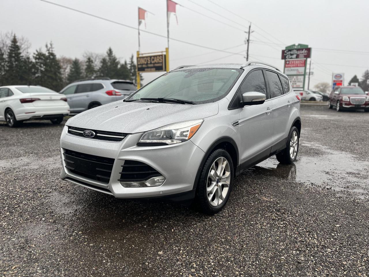 <p>*CERTIFIED,</p><p>We finance</p><p>Contact us for pre approval,</p><p>DINOS CARS</p><p>-Safety certification included in the price ( UNLESS SPECIFIED OTHERWISE ie. AS IS VEHICLES)</p><p>-IF YOU CANT COME TO US WELL DRIVE TO YOU ( WITHIN A REASONABLE DISTANCE TO VIEW) DELIVERY ALSO AVAILABLE</p><p>-Certified Quality Pre owned Vehicles</p><p>-Carfax history report available for every vehicle</p><p>-Licensing and tax are extra</p><p>-Open by Appointment Call or text(519)697-3866</p><p>-4016 Dundas St E, London, ON N5V 5C6</p><p>Looking for a versatile and reliable SUV thats ready for any adventure? Look no further than this sleek silver 2014 Ford Escape Titanium, available now at Dinos Cars. This well-maintained Escape is ready to hit the road with its spacious black interior, comfortable seating, and a smooth automatic transmission. With its proven track record and reputation for dependability, the Escape Titanium is a popular choice for Canadian drivers, and this one has been driven just 162,581km.</p><p>This Escape Titanium is equipped with a 4-wheel drive system, ready to tackle those snowy Canadian winters or weekend getaways off the beaten path. This SUV offers the perfect combination of practicality and style, making it an ideal choice for families, commuters, or anyone who enjoys an active lifestyle. This Escape Titanium is ready to take you where you need to go, in comfort and style.</p><p>Here are some of the standout features that make this Escape Titanium a must-see:</p><ul><li><strong>Premium Titanium Trim:</strong> Experience the luxury and comfort that comes with the top-of-the-line Titanium trim, offering a host of premium features.</li><li><strong>4-Wheel Drive Confidence:</strong> Navigate any road condition with the sure-footedness of 4-wheel drive, providing enhanced traction and control.</li><li><strong>Fuel-Efficient Performance:</strong> Enjoy the balance of performance and fuel economy that this Escape offers, perfect for daily commutes and longer journeys.</li><li><strong>Spacious Interior:</strong> With ample room for passengers and cargo, this Escape is ready for any adventure.</li><li><strong>Dependable Ford Reliability:</strong> Built with Fords reputation for durability, you can count on this Escape for years of dependable service.</li></ul><p><strong><em>Powered by AutoIntelligence&trade;</em></strong> Vehicle information has been generated using artificial intelligence and is provided for informational purposes only. While efforts are made to ensure accuracy, please confirm all details directly with the dealer.</p>