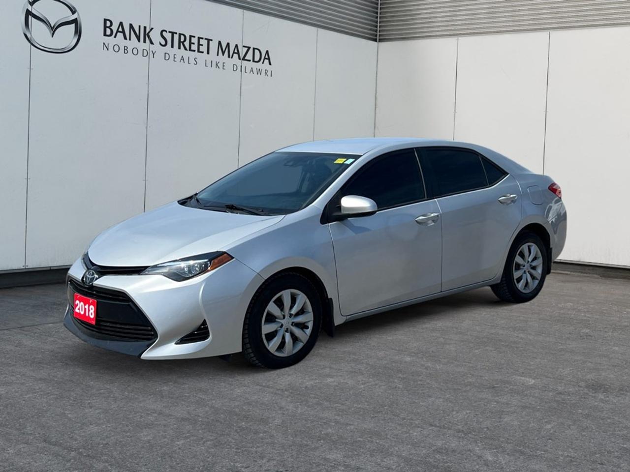 Introducing the 2018 Toyota Corolla LE CVT, a stunning White sedan with a Front-Wheel Drive (FWD) system that ensures smooth and responsive handling. This versatile vehicle combines practicality with style, making it a perfect choice for daily commuting and weekend adventures alike. The Corollas sleek white exterior is both timeless and modern, capturing attention wherever you go. Step inside to discover a thoughtfully designed interior, where comfort and functionality come together seamlessly. Premium materials and a spacious cabin create an inviting atmosphere for both driver and passengers. Equipped with a range of advanced technologies, the Corolla LE CVT features a backup camera for easy parking, as well as a Bluetooth connection that keeps you connected on the go. Safety is a top priority with built-in lane assist and brake assist systems, ensuring peace of mind on every journey. Enjoy the convenience of power windows and cruise control for an enhanced driving experience. With its reliability and outstanding features, the 2018 Toyota Corolla LE CVT is an exceptional choice for young professionals and small families seeking a dependable and stylish vehicle. Contact us today to schedule a test drive and see for yourself what makes this sedan a standout choice.