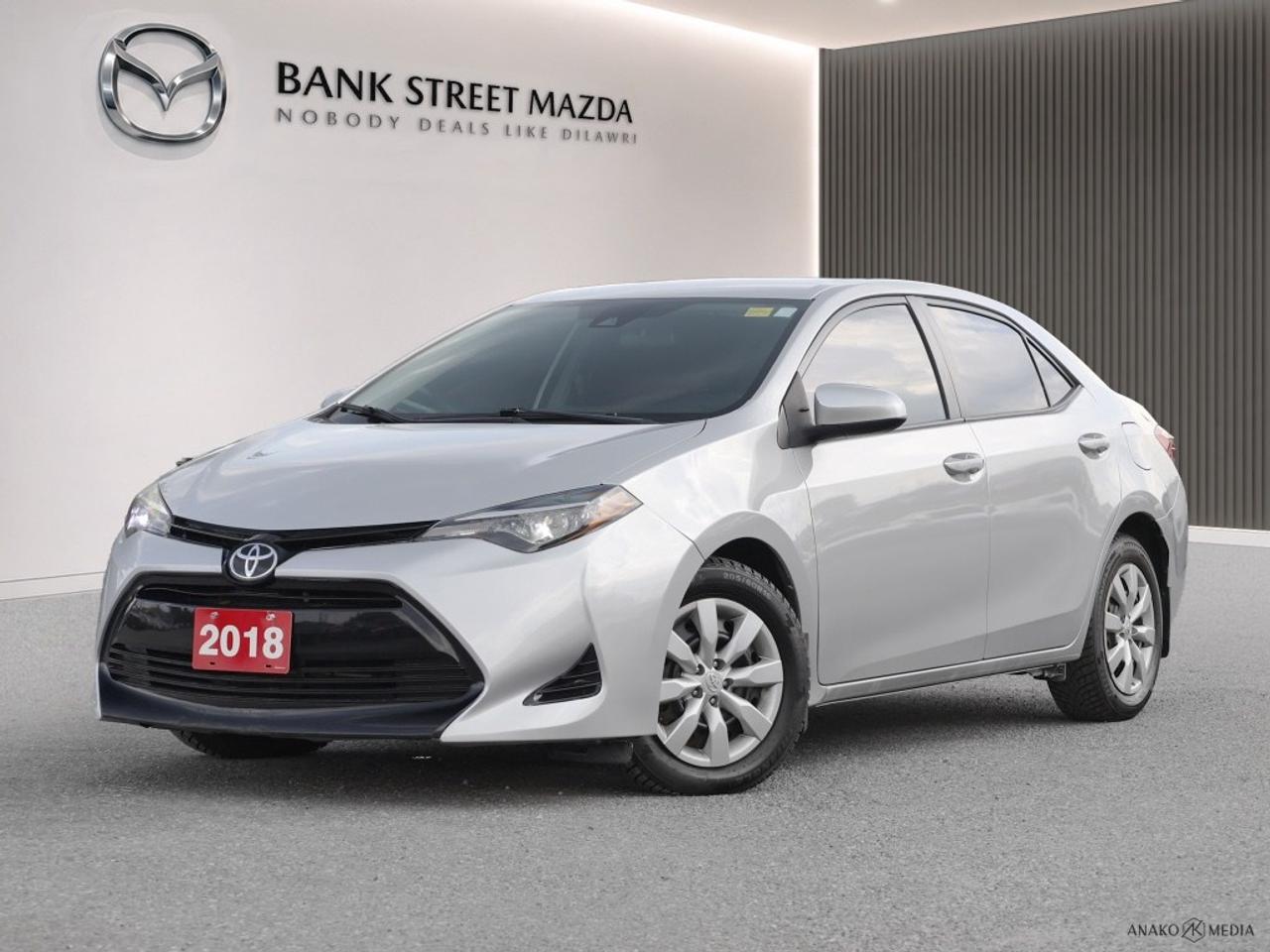 Introducing the 2018 Toyota Corolla LE CVT, a stunning White sedan with a Front-Wheel Drive (FWD) system that ensures smooth and responsive handling. This versatile vehicle combines practicality with style, making it a perfect choice for daily commuting and weekend adventures alike. The Corollas sleek white exterior is both timeless and modern, capturing attention wherever you go. Step inside to discover a thoughtfully designed interior, where comfort and functionality come together seamlessly. Premium materials and a spacious cabin create an inviting atmosphere for both driver and passengers. Equipped with a range of advanced technologies, the Corolla LE CVT features a backup camera for easy parking, as well as a Bluetooth connection that keeps you connected on the go. Safety is a top priority with built-in lane assist and brake assist systems, ensuring peace of mind on every journey. Enjoy the convenience of power windows and cruise control for an enhanced driving experience. With its reliability and outstanding features, the 2018 Toyota Corolla LE CVT is an exceptional choice for young professionals and small families seeking a dependable and stylish vehicle. Contact us today to schedule a test drive and see for yourself what makes this sedan a standout choice.