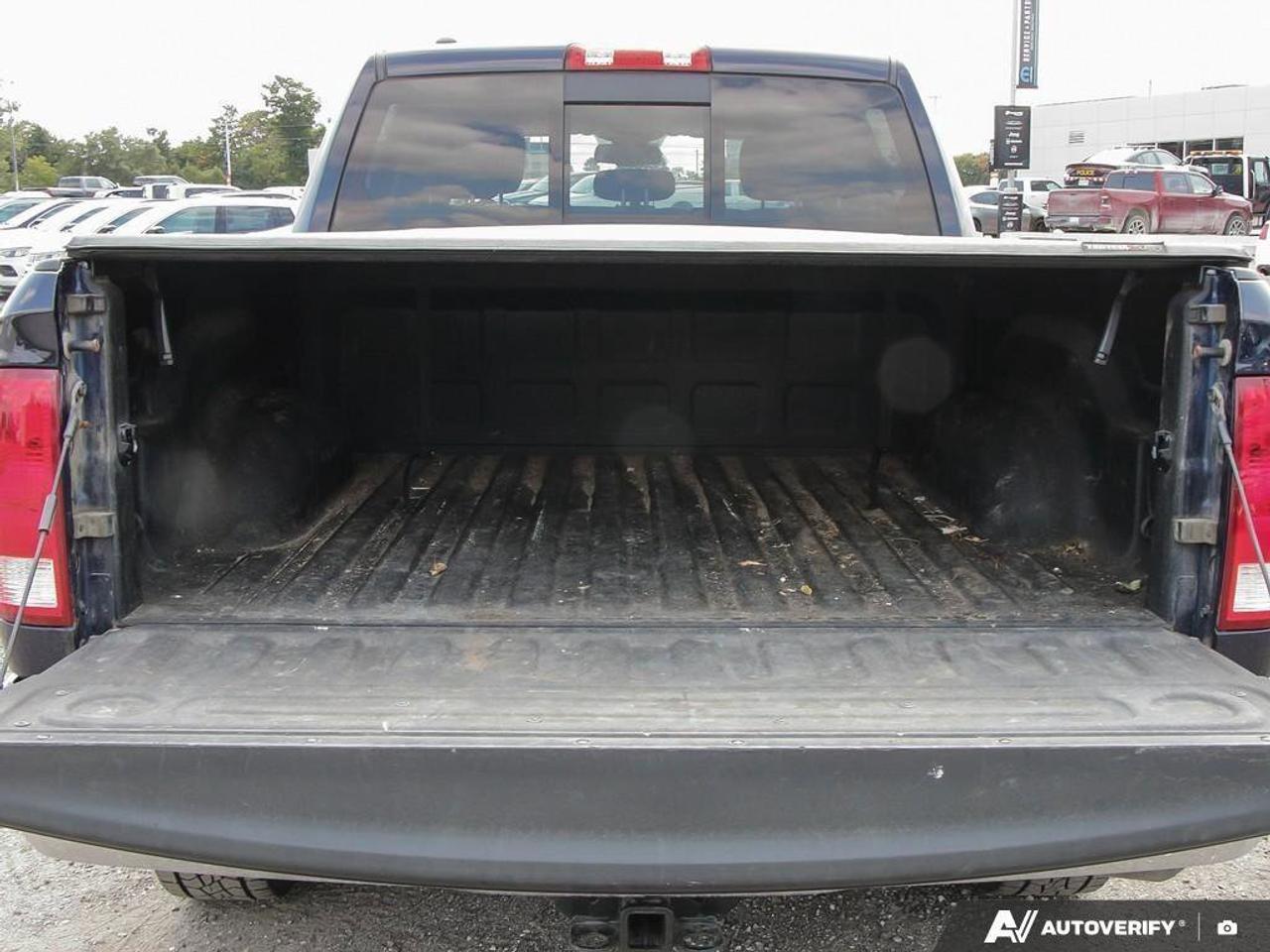 2016 RAM 1500 4WD Crew Cab 140.5  SLT Photo