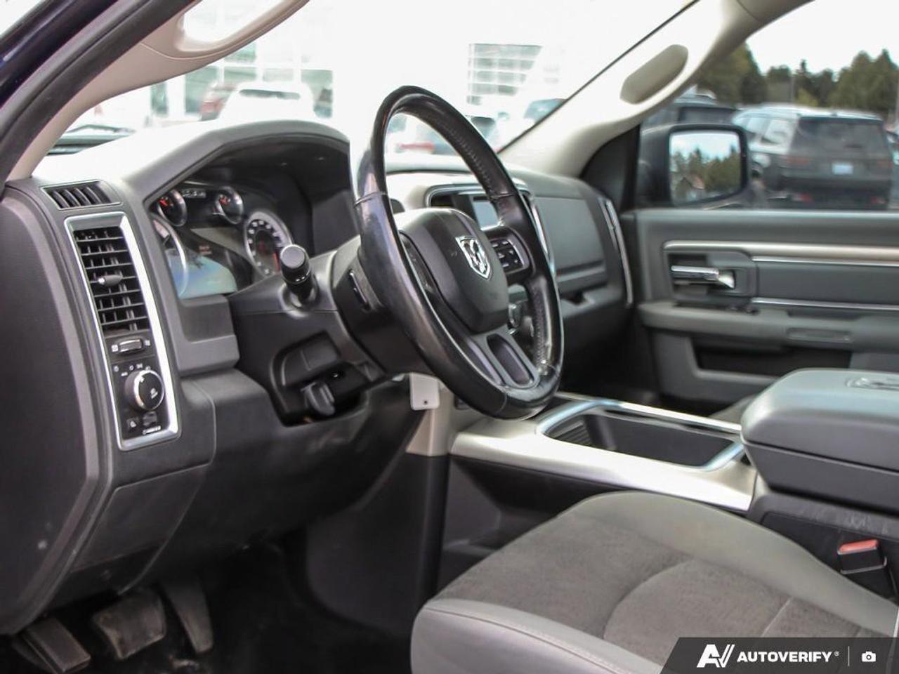 2016 RAM 1500 4WD Crew Cab 140.5  SLT Photo