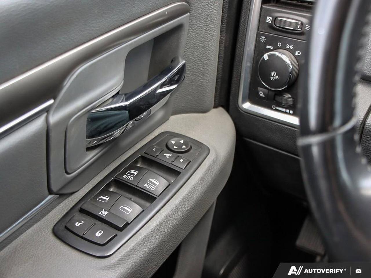 2016 RAM 1500 4WD Crew Cab 140.5  SLT Photo
