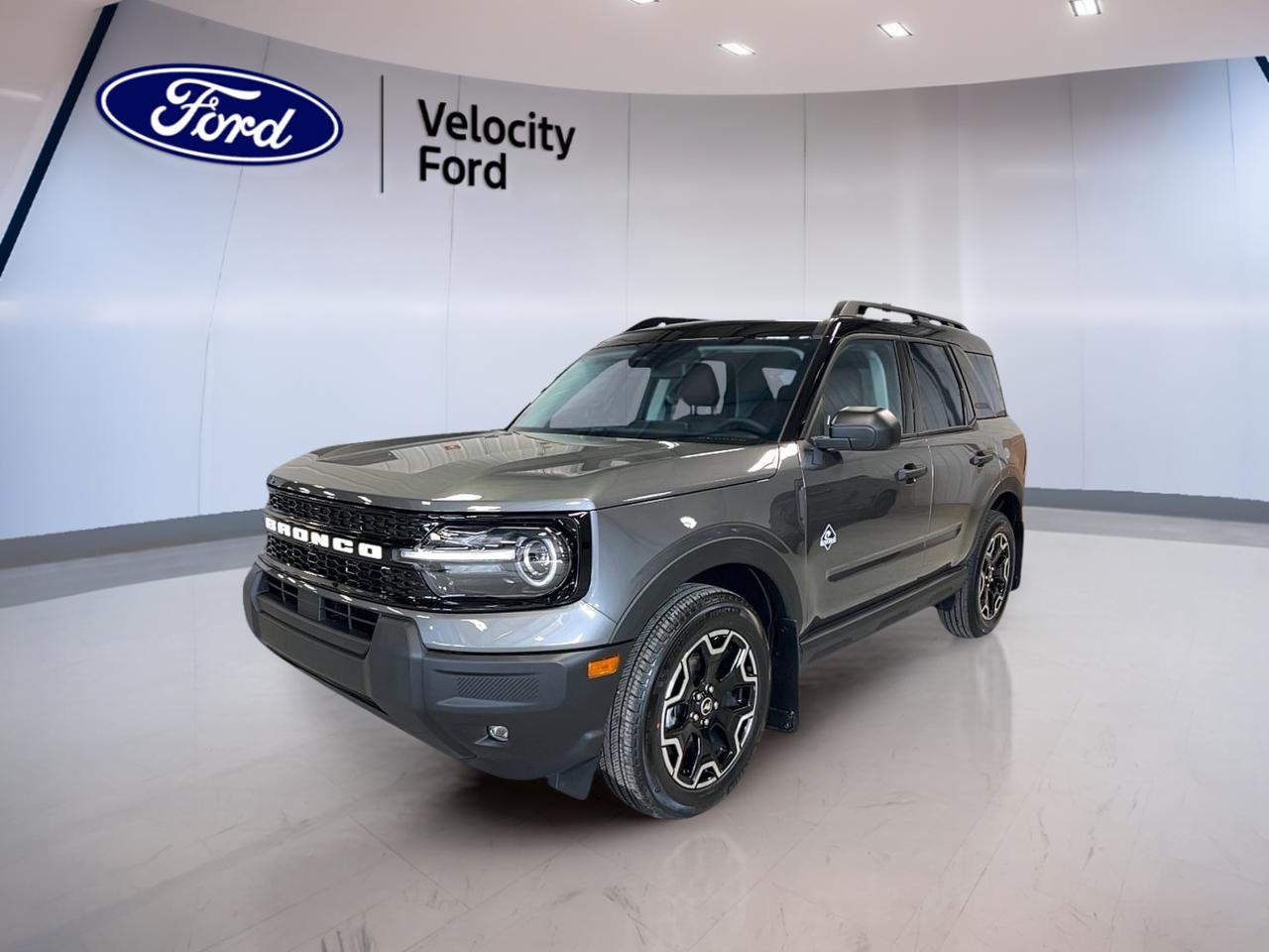 The 2026 Ford Bronco Sport Outer Banks 4x4 is brand new and ready for life in Moose Jaw. Finished in Grey with a Black interior, this compact SUV pairs everyday comfort with true Ford utility. Its 1.5-litre unleaded engine and 8-speed automatic transmission deliver smooth, confident power for city streets and changing prairie roads.

With 4 doors, four-wheel drive, and a practical cabin, the 2026 Ford Bronco Sport Outer Banks 4x4 fits daily driving, weekend travel, and all-season use with ease. Velocity Ford is offering a well-equipped new SUV with the key features drivers want most, including heated front seats, remote starter, and advanced driver-assist technology.

FEATURES OF THE Bronco Sport Outer Banks 4x4

»» Grey exterior with Black interior
»» Four-wheel drive for added traction
»» 1.5-litre unleaded engine with automatic
»» Brand new SUV at Velocity Ford

ADVANCED SAFETY FEATURES

»» Backup camera helps with reversing visibility
»» Blind spot monitor adds lane awareness
»» Lane departure warning supports safer travel
»» Side and head airbags enhance protection

PERFORMANCE AND EFFICIENCY

»» 1.5-litre engine balances power and economy
»» 8-speed automatic supports smooth shifting
»» Four-wheel drive improves year-round confidence
»» Stability control helps maintain composure

COMFORT AND CONVENIENCE

»» Heated front seats add cold-weather comfort
»» Dual-zone climate control aids cabin comfort
»» Remote starter adds everyday convenience
»» Power seats include driver lumbar support

TECHNONOLGY AND CONNECTIVITY

»» Bluetooth integration supports hands-free calling
»» WiFi hotspot keeps devices connected
»» Satellite radio expands entertainment choices
»» Steering wheel audio controls simplify use

CARGO SPACE

»» Rear trunk access simplifies loading tasks
»» Four-door layout improves passenger entry
»» Practical cargo area suits daily gear
»» Power windows add everyday ease

WHAT OTHER OWNERS LIKE

»» Easy driving position and outward visibility
»» Useful cargo room for daily needs
»» Winter-friendly heated features and four-wheel drive
»» User-friendly controls and connected technology

This 2026 Ford Bronco Sport Outer Banks 4x4 brings together useful comfort, smart safety, and the sure-footed feel of 4WD. It includes cruise control, power steering, anti-lock braking system, stability control, child safety locks, automatic headlights, fog lights, tinted windows, heated mirrors, electric mirrors, memory mirrors, and an auto-dimming rearview mirror.

Inside, the 2026 Ford Bronco Sport Outer Banks 4x4 offers front air conditioning, automatic climate control, push button start, illuminated vanity mirrors, rear window defroster, automatic door locks, and a clean, functional layout made for daily use. The automatic transmission works well with the turbocharged character of this Ford SUV for relaxed commuting and easy highway travel.

Drivers shopping at Velocity Ford will also value the convenience features in this 2026 Ford Bronco Sport Outer Banks 4x4, including power windows, adjustable steering wheel, memory seat settings, electric passenger seat, and steering wheel audio controls. The result is a new SUV that feels ready for Saskatchewan weather, family routines, and weekend plans.

This 2026 Ford Bronco Sport Outer Banks 4x4s VIN is: 3FMCR9CN2TRE16789.