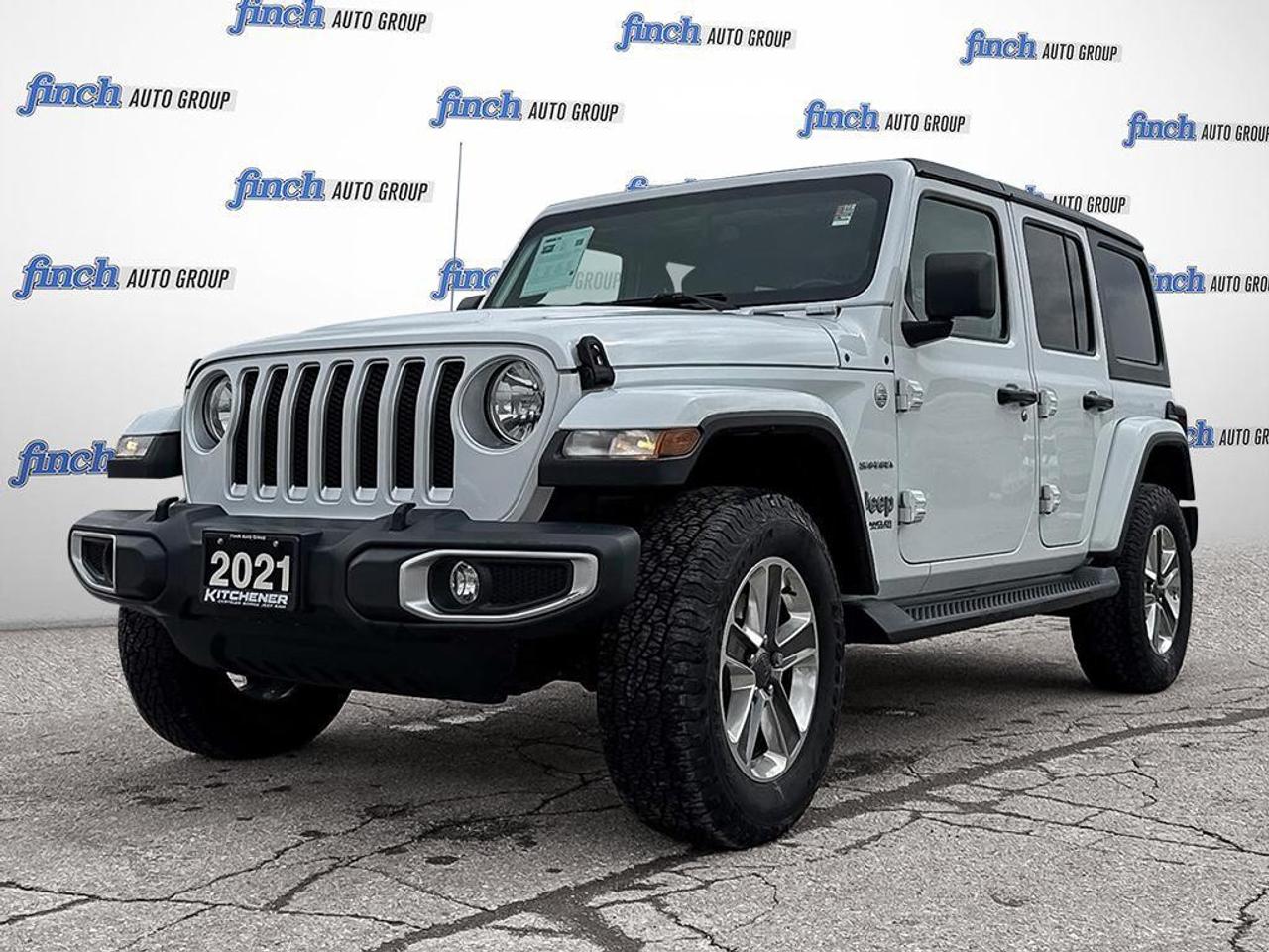 <p>Experience the perfect blend of rugged capability and refined comfort with the 2021 Jeep Wrangler Unlimited Sahara, designed for adventurers who demand versatility and style.</p><p>This one-owner Jeep Wrangler Unlimited Sahara in striking white is equipped with a 2.0L turbocharged 4-cylinder engine paired with an 8-speed automatic transmission, delivering responsive power and impressive fuel efficiency on and off the beaten path. Its advanced 4x4 drivetrain, complemented by brake-actuated limited-slip differential and stability control, ensures confident handling across diverse terrains, whether navigating rocky trails or urban streets. The Sahara trims Alpine Audio Quick Order Package 22G provides premium sound quality, ideal for immersive drives. Inside, bucket seats with driver-adjustable lumbar support offer comfort during extended journeys, while the pass-through rear seat adds practicality for gear or passengers. Safety is paramount with features like rollover protection bars, multiple airbags, and traction control, giving peace of mind on every excursion. Convenience meets technology with keyless entry and start, a backup camera, Bluetooth connectivity, and smart device integration, keeping you connected without distraction. Exterior touches such as running boards, fog lamps, heated mirrors, and aluminum wheels enhance both function and style. Whether tackling rugged trails or cruising city roads, this Jeep Wrangler Unlimited Sahara is ready to accompany your next adventure with confidence and flair.</p><p></p>
