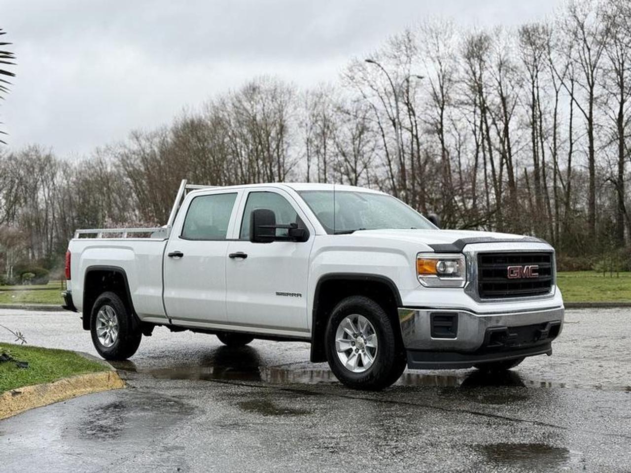 This 2015 GMC Sierra 1500 Crew Cab short box pickup is powered by a 4.3L V6 paired with an automatic transmission and rear-wheel drive. It features seating for up to six passengers and is equipped with cruise control, air conditioning, Bluetooth connectivity, AM/FM radio, and a backup camera. Additional equipment includes a headache rack, tow mirrors, and power windows, power door locks, and power mirrors. Finished in white with a grey cloth interior, this four-door pickup offers a practical and comfortable setup suitable for work, commuting, or everyday use.  $19,830.00 plus $375 processing fee, $20,205.00 total payment obligation before taxes.   Listing report, warranty, contract commitment cancellation fee, financing available on approved credit (some limitations and exceptions may apply). All above specifications and information is considered to be accurate but is not guaranteed and no opinion or advice is given as to whether this item should be purchased. We do not allow test drives due to theft, fraud, acts of vandalism and undetectable impaired driving. Instead we provide the following benefits: Complimentary Warranty (with options to extend), Limited Money Back Satisfaction Guarantee on Fully Completed Contracts, Contract Commitment Cancellation, and an Open-Ended Sell-Back Option. Ask seller for details or call 604-522-REPO(7376) to confirm listing availability.