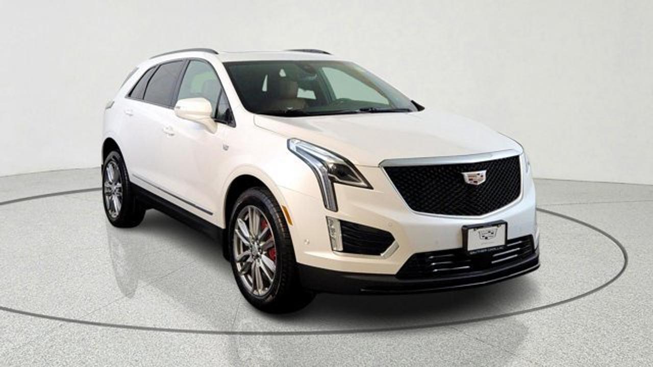 The 2026 Cadillac XT5 AWD Sport is a performance-oriented version of Cadillacs luxury compact SUV. Powered by a robust 3.6 L V6 engine paired with a twin-clutch Sport Control all-wheel-drive system for confident acceleration and traction. It adds sport-tuned enhancements like Chassis Damping Control with Yaw Control, Brembo performance front brakes, and distinctive 20-inch 12-spoke alloy wheels that elevate both handling and presence. Inside and out, the Sport trim builds on premium features with gloss black roof rails, tri-zone climate control, advanced driver-assist technologies, and Cadillacs upscale interior amenities for a blend of capability, comfort, and style.
