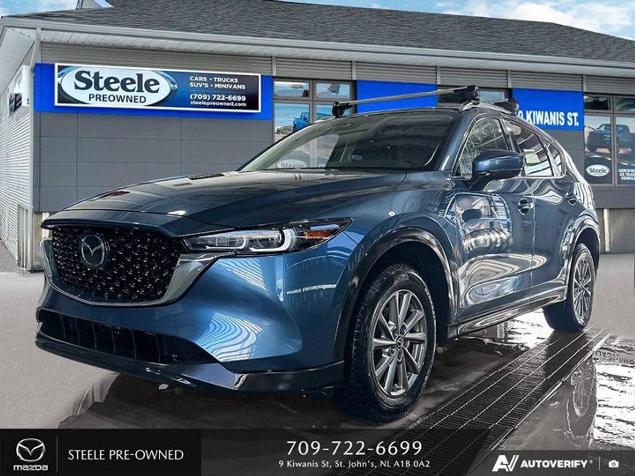 This Used 2022 Mazda CX-5 GS at Steele Mazda St. Johns is a fantastic option for anyone in the market for a reliable and stylish SUV. With just 62,698 kilometers on the odometer, this vehicle is in great condition and ready to hit the road. The gasoline engine is a Regular Unleaded I-4 2.5 L/152, providing plenty of power while still offering decent fuel efficiency with city KM/L at 10 and highway KM/L at 8. The vehicle options are also impressive, including a radio with AM/FM/HD Audio System w/6 Speakers, a large 10.25 full colour centre display with Mazda Connect Infotainment system, Apple CarPlay and Android Auto compatibility, Bluetooth connectivity with audio controls on the steering wheel, navigation-ready capability (requires navigation SD card accessory), SMS text message functionality, and cylinder deactivation display. With all of these features and more, this Used 2022 Mazda CX-5 GS is sure to impress any potential buyer looking for comfort and convenience in their next vehicle purchase.