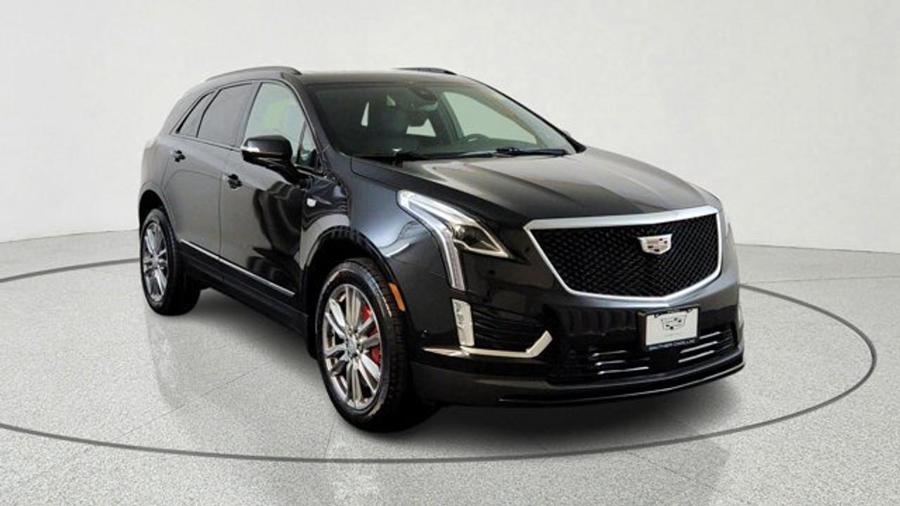 The 2026 Cadillac XT5 AWD Sport is a performance-oriented version of Cadillacs luxury mid-size SUV. It pairs a potent 3.6 L V6 engine with a 9-speed automatic transmission and twin-clutch Sport Control all-wheel drive for stronger acceleration and confident handling. It stands out with sport-tuned suspension (Chassis Damping Control and yaw control), Brembo performance brakes with red calipers, 20-inch 12-spoke alloy wheels, gloss black accents, and premium features like tri-zone climate control and advanced driver-assistance tech for comfort and capability on varied roads. Inside, the Sport trim blends comfort and connectivity with features such as heated/ventilated seats, wireless smartphone integration navigation and safety systems.