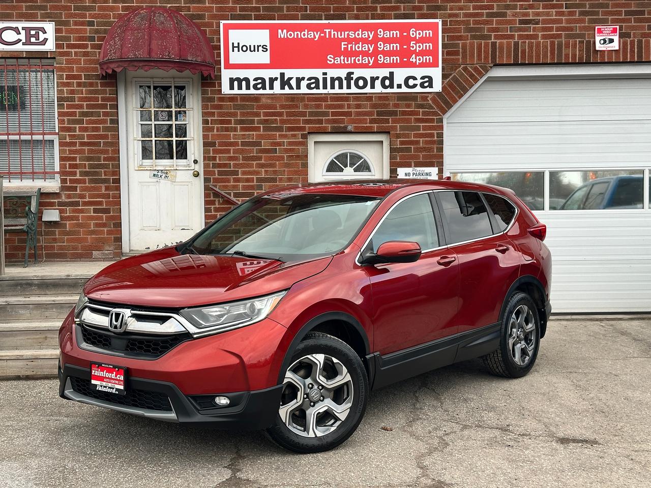 <p>WOW! Super-Clean and well-optioned Honda CR-V from Kanata, ON! This EX-L AWD model looks awesome in its Red/Orange paint and factory alloy wheels with great options inside and out! The exterior features keyless entry with remote start and proximity keys, remote power rear liftgate, a large factory power Sunroof, colour-matched side mirrors with integrated turn signals and passenger side blind spot monitor camera, automatic headlights, foglights, adaptive cruise and lane keeping assist, forward collision warning, tinted privacy glass, a sleek rear spoiler, gorgeous factory alloy wheels, a peppy fuel efficient 1.5L 4-Cylinder Turbocharged Engine and CVT Auto transmission powering the All-Wheel-Drive system! The interior is clean and comfortable with heated leather front and rear seating, power adjustable front seating with drivers lumbar controls and memory seating, power door locks, windows and mirrors, wood trim interior accents, a heated leather wrapped steering wheel with Audio and Cruise controls, heated windscreen wiper area, an easy to read and use gauge cluster, push button start, a large central touch screen AM/FM/XM Satellite Radio with Bluetooth, SmartPhone connection, Backup Camera and Blind Spot Camera display, Dual-Zone A/C climate controls with front and rear window defrost settings, ECON driving mode for improved fuel economy, universal garage door openers, USB/AUX/12V accessory ports and more!</p><p>&nbsp;</p><p>Carfax Claims Free, Sharp-Looking SUV with Great Options and Styling!</p><p>&nbsp;</p><p>Call (905) 623-2906</p><p>&nbsp;</p><p>Text Ryan: (905) 429-9680 or email: ryan@markrainford.ca</p><p>&nbsp;</p><p>Text Mark: (905) 431-0966 or email: mark@markrainford.ca</p>