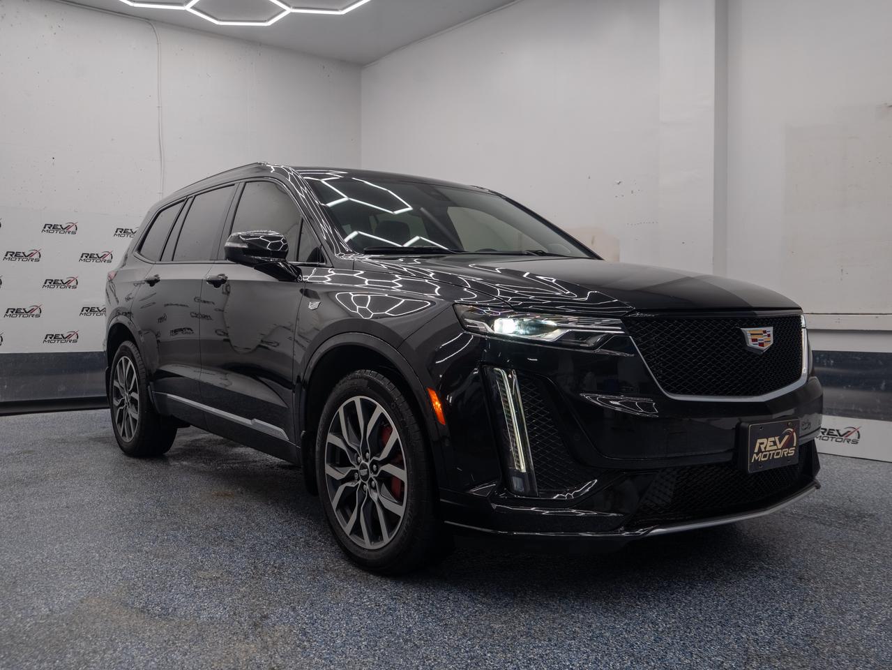 2023 Cadillac XT6 Sport | 360 Camera | Heated and Ventilated Seats | Heated Steering | Head-Up Display<br/> <br/> Black Exterior | Black Leather Interior | Alloy Wheels | Keyless Entry | Blind Spot Assist | Front Power Seats | Front and Rear Heated Seats | Power Tailgate | Rear Climate Control | Voice Control | Bluetooth Connection | Cruise Control | Pre-Collision Avoidance | Heated Steering Wheel | Apple CarPlay | Android Auto | Front Ventilated Seats | Parking Aid | Traction Control | Drive Mode Select | Fold-In Power Mirrors | Bose Speakers | Head-Up Display | Panoramic Sunroof | Push Button Start | 360 Camera | Lane Keep Assist | Navigation | Forward Collision System | Front Pedestrian Detection | Rear Cross Traffic Alert | Rain Sensing Wipers | Remote Start and much more. <br/> <br/> <br/> Make a bold statement wherever the road takes you with the 2023 Cadillac XT6 Sport, a luxury SUV designed for those who crave power, sophistication, and cutting-edge technology. <br/> <br/> <br/> Key Features: <br/> <br/> <br/> Striking & Athletic Design: The bold front grille, sleek LED lighting, and sculpted body lines give the XT6 Sport a commanding presence while ensuring aerodynamic efficiency. <br/> <br/> <br/> Refined Interior: Indulge in premium comfort with Jet Black leather seating surfaces, ambient lighting, and a panoramic sunroof that enhances the driving atmosphere. <br/> <br/> <br/> Advanced Technology: Seamlessly integrate with wireless Apple CarPlay & Android Auto, enjoy immersive audio with a Bose® Performance Series 14-speaker system, and navigate effortlessly with an intuitive 8-inch touchscreen infotainment system. <br/> <br/> <br/> Powerful Performance: A 3.6L V6 engine delivers 310 horsepower and 271 lb-ft of torque, paired with a 9-speed automatic transmission for smooth and responsive acceleration. The Sport Control AWD system ensures confident handling in all conditions. <br/> <br/> <br/> Exceptional Handling: Experience precision and control with front Brembo® brakes and adaptive suspension, built to enhance agility and stability. <br/> <br/> <br/> Comprehensive Safety & Driver Assistance: Drive with confidence, thanks to features like blind-spot monitoring, lane-keeping assist, forward collision warning, and adaptive cruise control. <br/> <br/> <br/> The 2023 Cadillac XT6 Sport blends luxury, performance, and innovative technology, making every drive an exhilarating experience. <br/> <br/> <br/> This vehicle has travelled 47,893 Kms. <br/> <br/> <br/> *** NO additional fees except for taxes and licensing! *** <br/> <br/> <br/> *** 100-point inspection on all our vehicles & always detailed inside and out *** <br/> <br/> <br/> RevMotors is at your service to ensure you find the right car for YOU. Even if we do not have it in our inventory, we are more than happy to find you the vehicle that you are looking for. Give us a call at 613-791-3000 or visit us online at www.revmotors.ca <br/> <br/> <br/> Ça nous donnera du plaisir de vous servir en Français aussi! <br/> <br/> <br/> CERTIFICATION * All our vehicles are sold Certified for the province of Ontario (Quebec Safety Available, additional charges may apply) <br/> FINANCING AVAILABLE * RevMotors offers competitive finance rates through many of the major banks. Should you feel like youve had credit issues in the past, we have various financing solutions to get you on the road. We accept No Credit - New Credit - Bad Credit - Bankruptcy - Students and more!! <br/> EXTENDED WARRANTY * For your peace of mind, if one of our used vehicles is no longer covered under the manufacturer’s warranty, RevMotors will provide you with a 6 month / 6000KMS Limited Powertrain Warranty. You always have the options to upgrade to more comprehensive coverage as well. Well be more than happy to review the options and chose the coverage thats right for you! <br/> TRADES * Do you have a Trade-in? We offer competitive trade in offers for your current vehicle! <br/> SHIPPING * We can ship anywhere across Canada. Give us a call for a quote and we will be happy to help! <br/> <br/> <br/> Buy with confidence knowing that we always have your best interests in mind! <br/>