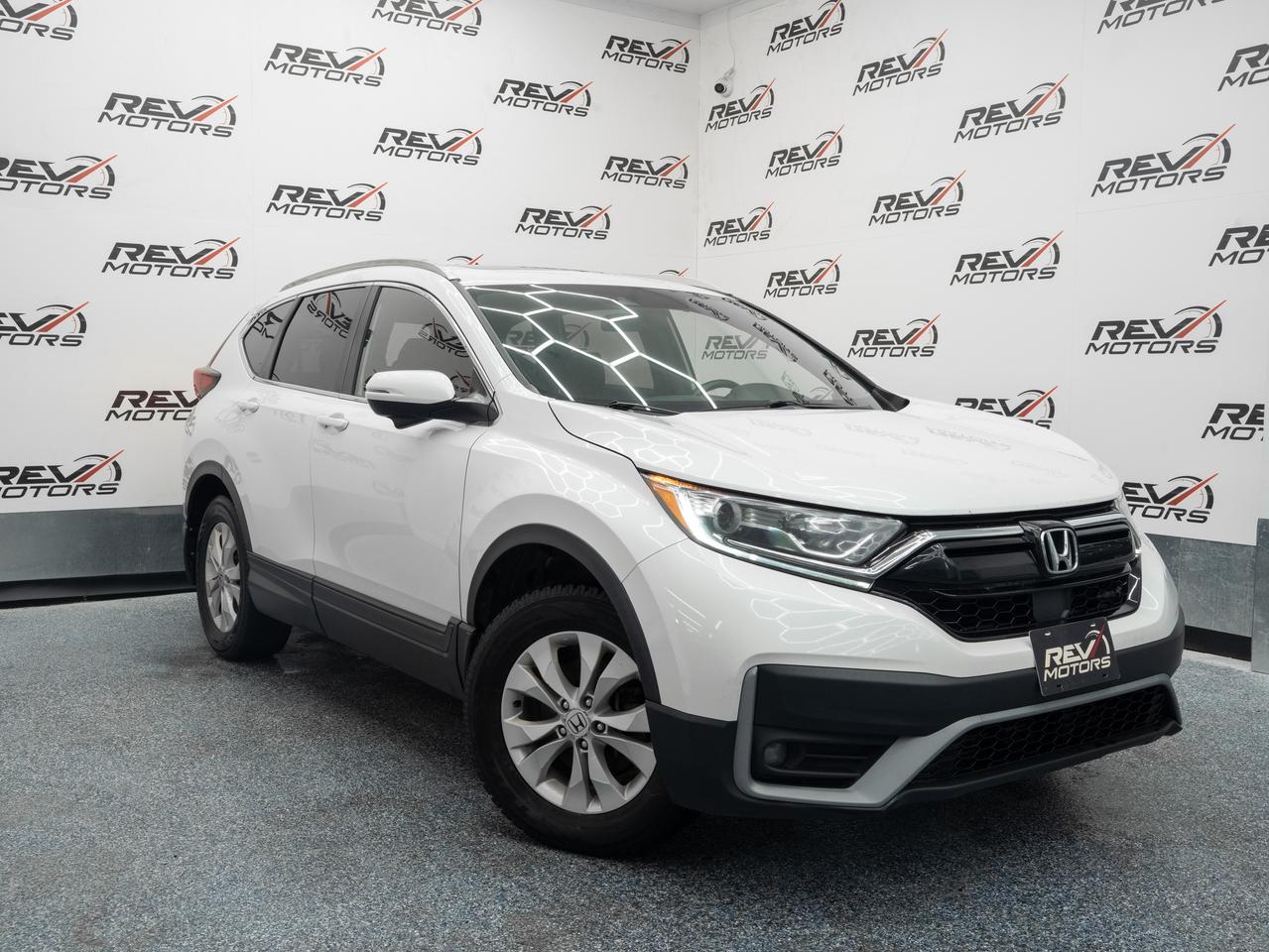 2020 Honda CR-V Sport | Bluetooth | No Accidents | Keyless Entry<br/> <br/> White Exterior | Black Interior | CR-V Sport Trim | 4-Door Compact SUV | Sleek Modern Styling | 19-Inch Alloy Wheels | Sport-Tuned Suspension | Keyless Entry | Push Button Start | Premium Cloth & Leatherette Upholstery | Navigation System 7-Inch Display Audio | Apple CarPlay & Android Auto | Bluetooth | Dual-Zone Climate Control | Automatic Transmission | Real Time AWD with Intelligent Control Versatile Utility and More <br/> <br/> <br/> Key Features: <br/> <br/> <br/> Bold Presence: <br/> The White exterior paired with a Black interior creates a clean, modern contrast. With sculpted body lines, sporty accents, and 19-inch alloy wheels, the CR-V Sport delivers a confident and athletic look. <br/> <br/> <br/> Efficient Performance: <br/> Powered by a 1.5L turbocharged inline-4 engine producing 190 horsepower, the CR-V Sport offers smooth acceleration and impressive fuel efficiency. Real Time AWD with Intelligent Control ensures stability and traction in varying conditions. <br/> <br/> <br/> Comfort and Practicality: <br/> Inside, the cabin features premium materials, supportive seating, and ample cargo space. Dual-zone climate control and ergonomic design provide comfort for both driver and passengers, making it ideal for daily commutes or long trips. <br/> <br/> <br/> Smart Connectivity: <br/> Equipped with a 7-inch Display Audio system, navigation, and smartphone integration, the CR-V Sport keeps you connected and entertained. Bluetooth and Apple CarPlay/Android Auto provide seamless communication and media access. <br/> <br/> <br/> Confidence and Control: <br/> Advanced safety features include Honda Sensing® technologies such as Collision Mitigation Braking System, Lane Keeping Assist, Adaptive Cruise Control, and Road Departure Mitigation. Combined with responsive handling, the CR-V Sport offers peace of mind on every drive. <br/> <br/> <br/> The 2020 Honda CR-V Sport is a versatile compact SUV that blends sporty design, efficient performance, and advanced technology. With its refined interior, practical utility, and confident driving dynamics, it delivers a well-rounded experience for both everyday use and weekend adventures. <br/> <br/> <br/> This Vehicle Has Travelled 116,859 Kms. <br/> <br/> <br/> *** NO additional fees except for taxes and licensing! *** <br/> <br/> <br/> *** 100-point inspection on all our vehicles & always detailed inside and out *** <br/> <br/> <br/> RevMotors is at your service to ensure you find the right car for YOU. Even if we do not have it in our inventory, we are more than happy to find you the vehicle that you are looking for. Give us a call at 613-791-3000 or visit us online at www.revmotors.ca <br/> <br/> <br/> Ça nous donnera du plaisir de vous servir en Français aussi! <br/> <br/> <br/> CERTIFICATION * All our vehicles are sold Certified for the province of Ontario (Quebec Safety Available, additional charges may apply) <br/> FINANCING AVAILABLE * RevMotors offers competitive finance rates through many of the major banks. Should you feel like youve had credit issues in the past, we have various financing solutions to get you on the road. We accept No Credit - New Credit - Bad Credit - Bankruptcy - Students and more!! <br/> EXTENDED WARRANTY * For your peace of mind, if one of our used vehicles is no longer covered under the manufacturer’s warranty, RevMotors will provide you with a 6 month / 6000KMS Limited Powertrain Warranty. You always have the options to upgrade to more comprehensive coverage as well. Well be more than happy to review the options and chose the coverage thats right for you! <br/> TRADES * Do you have a Trade-in? We offer competitive trade in offers for your current vehicle! <br/> SHIPPING * We can ship anywhere across Canada. Give us a call for a quote and we will be happy to help! <br/> <br/> <br/> Buy with confidence knowing that we always have your best interests in mind! <br/>