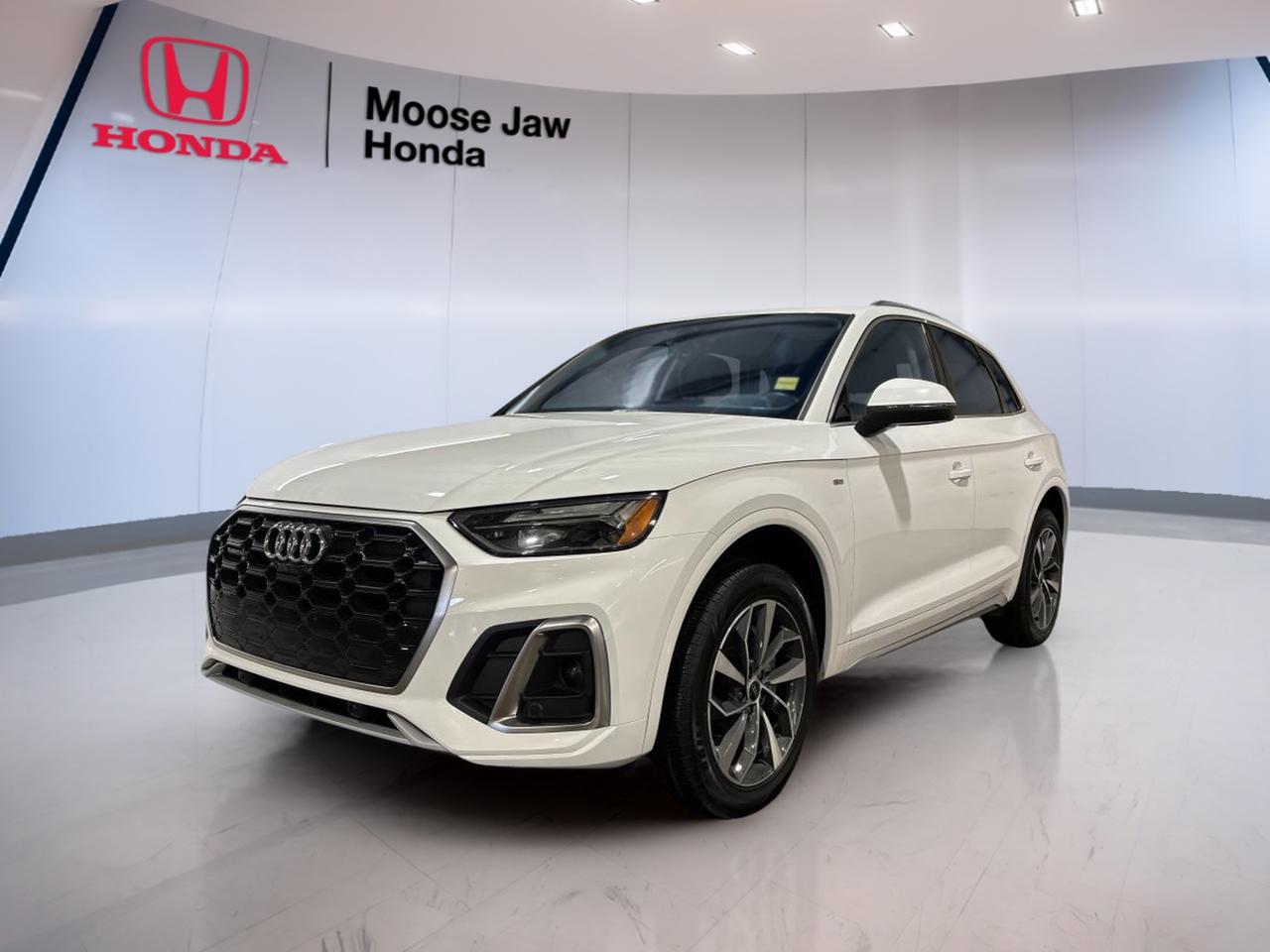 Meet the 2022 Audi Q5 Progressiv, a premium compact SUV that fits life in Moose Jaw with ease. Finished in clean White, this used Q5 Progressiv blends everyday comfort with confident all-weather ability. With 79,075 km, its ready for more road trips, commutes, and weekend errands.

Under the hood, the 2.0 TFSI 4-cylinder delivers 261 hp and is paired with a smooth 7-speed S tronic automatic transmission. The added 12 V mild hybrid system helps support efficiency in stop-and-go driving. With Audi traction intégrale (all-wheel drive), you get sure-footed control when roads turn wet, snowy, or dusty.

At Moose Jaw Honda, this Q5 Progressiv is a smart choice for drivers who want refined power, a quiet ride, and the confidence of a well-engineered Audi SUV. It feels composed on the highway, easy to place in town, and solid in changing prairie weather.

FEATURES OF THE Q5 Progressiv  
»» Progressiv trim with premium Audi feel  
»» 7-speed S tronic automatic transmission  
»» Audi all-wheel drive for four-season confidence  
»» 2.0 TFSI engine with 12 V MHEV  

ADVANCED SAFETY FEATURES  
»» All-wheel traction helps in poor weather  
»» Stable handling feel at highway speeds  
»» Confident braking feel for daily driving  
»» Clear outward visibility for city manoeuvres  

PERFORMANCE AND EFFICIENCY  
»» 261 hp turbocharged 2.0 TFSI power  
»» 7-speed S tronic quick, smooth shifting  
»» 12 V mild hybrid system assists efficiency  
»» All-wheel drive adds confident acceleration grip  

COMFORT AND CONVENIENCE  
»» SUV ride height for easier entry  
»» Quiet cabin feel for long drives  
»» Practical layout for daily commuting  
»» Easy-to-use controls within driver reach  

TECHNONOLGY AND CONNECTIVITY  
»» Modern Audi interface designed for clarity  
»» Driver-focused layout reduces distraction  
»» Quick access to key vehicle settings  
»» Clean, simple displays support daily use  

CARGO SPACE  
»» Rear cargo area suits weekly errands  
»» Wide opening makes loading easier  
»» SUV shape supports bulky items  
»» Flexible space for active lifestyles  

WHAT OTHER OWNERS LIKE  
»» Confident all-wheel drive in winter  
»» Smooth, quick S tronic shifting  
»» Strong turbo power for passing  
»» Premium feel in daily driving  

This 2022 Audi Q5 Progressivs VIN is: WA1EAAFY9N2063447.<p> the 2.0 TFSI 4-cylinder delivers 261 hp and is paired with a smooth 7-speed S tronic automatic transmission. The added 12 V mild hybrid system helps support efficiency in stop-and-go driving. With Audi traction intégrale (all-wheel drive)</p>
<p> and solid in changing prairie weather.

FEATURES OF THE Q5 Progressiv  
»» Progressiv trim with premium Audi feel  
»» 7-speed S tronic automatic transmission  
»» Audi all-wheel drive for four-season confidence  
»» 2.0 TFSI engine with 12 V MHEV  

ADVANCED SAFETY FEATURES  
»» All-wheel traction helps in poor weather  
»» Stable handling feel at highway speeds  
»» Confident braking feel for daily driving  
»» Clear outward visibility for city manoeuvres  

PERFORMANCE AND EFFICIENCY  
»» 261 hp turbocharged 2.0 TFSI power  
»» 7-speed S tronic quick</p>
<p> smooth shifting  
»» 12 V mild hybrid system assists efficiency  
»» All-wheel drive adds confident acceleration grip  

COMFORT AND CONVENIENCE  
»» SUV ride height for easier entry  
»» Quiet cabin feel for long drives  
»» Practical layout for daily commuting  
»» Easy-to-use controls within driver reach  

TECHNONOLGY AND CONNECTIVITY  
»» Modern Audi interface designed for clarity  
»» Driver-focused layout reduces distraction  
»» Quick access to key vehicle settings  
»» Clean</p>
<p> simple displays support daily use  

CARGO SPACE  
»» Rear cargo area suits weekly errands  
»» Wide opening makes loading easier  
»» SUV shape supports bulky items  
»» Flexible space for active lifestyles  

WHAT OTHER OWNERS LIKE  
»» Confident all-wheel drive in winter  
»» Smooth</p>
<p> quick S tronic shifting  
»» Strong turbo power for passing  
»» Premium feel in daily driving  

This 2022 Audi Q5 Progressivs VIN is: WA1EAAFY9N2063447.</p>