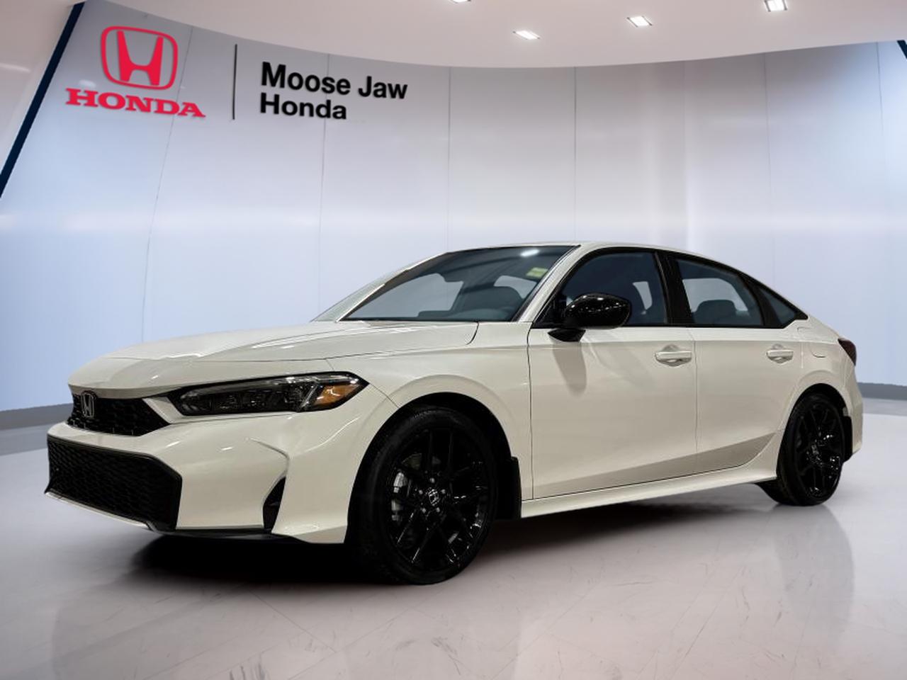 The brand new 2026 Honda Civic Hybrid Sport at Moose Jaw Honda brings smart efficiency, clean design, and everyday ease to your drive in Moose Jaw. Finished in White with a Black interior, this sedan pairs Honda hybrid innovation with a smooth Electro-CVT transmission and confident front-wheel drive.

Built for drivers who want low fuel use without giving up comfort, the 2026 Honda Civic Hybrid Sport feels refined, modern, and ready for daily life. Its 2.0-litre 16-valve DOHC Dual-VTC inline 4-cylinder engine works with Hondas hybrid system to deliver responsive power and quiet operation in city and highway driving.

FEATURES OF THE Civic Hybrid Sport

»» Brand new hybrid sedan with Sport trim  
»» White exterior with Black interior  
»» Electro-CVT with Econ and Normal  
»» Front-wheel drive for everyday confidence  

ADVANCED SAFETY FEATURES

»» Honda Sensing suite supports safer driving  
»» Collision mitigation braking helps avoid impacts  
»» Lane keeping assist supports highway control  
»» Road departure mitigation adds extra confidence  

PERFORMANCE AND EFFICIENCY

»» 2.0-litre hybrid powertrain balances power efficiently  
»» Electro-CVT delivers smooth seamless acceleration  
»» Econ and Normal drive modes included  
»» Front-wheel drive supports stable daily handling  

COMFORT AND CONVENIENCE

»» Four-door sedan layout suits daily use  
»» Spacious cabin design feels open inside  
»» Easy controls support simple daily operation  
»» Sport trim adds a focused feel  

TECHNONOLGY AND CONNECTIVITY

»» Clear driver displays show key information  
»» Hybrid system data helps track efficiency  
»» Simple interface keeps functions easy  
»» Modern cabin layout supports connectivity needs  

CARGO SPACE

»» Sedan trunk handles daily cargo well  
»» Rear seat area supports passenger comfort  
»» Wide opening helps load essentials  
»» Useful storage for work or errands  

AWARDS & RECOGNITIONS

»» 2025 North American Car of the Year, North American Car, Utility and Truck of the Year

WHAT OTHER OWNERS LIKE

»» Excellent fuel economy for daily commuting  
»» Smooth quiet ride in urban traffic  
»» Easy-to-use controls and clear displays  
»» Strong balance of comfort and agility  

The 2026 Honda Civic Hybrid Sport stands out for the right reasons. It gives you the efficiency of a modern hybrid, the practicality of a compact sedan, and the trusted engineering drivers expect from Honda. The White exterior keeps the look clean and fresh, while the Black interior adds a neat, sporty cabin atmosphere.

This new 2026 Honda Civic Hybrid Sport is a smart fit for commuting, family use, and long drives across Saskatchewan. The hybrid system helps reduce fuel stops, and the Electro-CVT keeps acceleration smooth and natural. With selectable Econ and Normal modes, it can adapt easily to changing road and traffic conditions.

For drivers shopping at Moose Jaw Honda, this 2026 Honda Civic Hybrid Sport offers a well-rounded package with proven value. It is efficient, comfortable, and practical, with the modern hybrid performance many Canadian drivers want in a new sedan.

This 2026 Honda Civic Hybrid Sports VIN is: 2HGFE4F82TH009333.<p> this sedan pairs Honda hybrid innovation with a smooth Electro-CVT transmission and confident front-wheel drive.

Built for drivers who want low fuel use without giving up comfort</p>
<p> and ready for daily life. Its 2.0-litre 16-valve DOHC Dual-VTC inline 4-cylinder engine works with Hondas hybrid system to deliver responsive power and quiet operation in city and highway driving.

FEATURES OF THE Civic Hybrid Sport

»» Brand new hybrid sedan with Sport trim  
»» White exterior with Black interior  
»» Electro-CVT with Econ and Normal  
»» Front-wheel drive for everyday confidence  

ADVANCED SAFETY FEATURES

»» Honda Sensing suite supports safer driving  
»» Collision mitigation braking helps avoid impacts  
»» Lane keeping assist supports highway control  
»» Road departure mitigation adds extra confidence  

PERFORMANCE AND EFFICIENCY

»» 2.0-litre hybrid powertrain balances power efficiently  
»» Electro-CVT delivers smooth seamless acceleration  
»» Econ and Normal drive modes included  
»» Front-wheel drive supports stable daily handling  

COMFORT AND CONVENIENCE

»» Four-door sedan layout suits daily use  
»» Spacious cabin design feels open inside  
»» Easy controls support simple daily operation  
»» Sport trim adds a focused feel  

TECHNONOLGY AND CONNECTIVITY

»» Clear driver displays show key information  
»» Hybrid system data helps track efficiency  
»» Simple interface keeps functions easy  
»» Modern cabin layout supports connectivity needs  

CARGO SPACE

»» Sedan trunk handles daily cargo well  
»» Rear seat area supports passenger comfort  
»» Wide opening helps load essentials  
»» Useful storage for work or errands  

AWARDS & RECOGNITIONS

»» 2025 North American Car of the Year</p>
<p> Utility and Truck of the Year

WHAT OTHER OWNERS LIKE

»» Excellent fuel economy for daily commuting  
»» Smooth quiet ride in urban traffic  
»» Easy-to-use controls and clear displays  
»» Strong balance of comfort and agility  

The 2026 Honda Civic Hybrid Sport stands out for the right reasons. It gives you the efficiency of a modern hybrid</p>
<p> and the trusted engineering drivers expect from Honda. The White exterior keeps the look clean and fresh</p>
<p> it can adapt easily to changing road and traffic conditions.

For drivers shopping at Moose Jaw Honda</p>
<p> with the modern hybrid performance many Canadian drivers want in a new sedan.

This 2026 Honda Civic Hybrid Sports VIN is: 2HGFE4F82TH009333.</p>