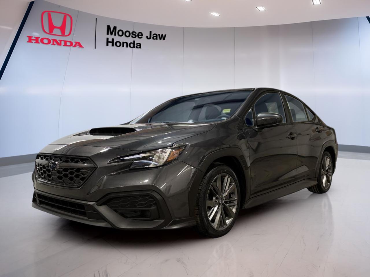 Meet a used 2023 Subaru WRX Base sedan that keeps the focus on what matters most: a true drivers car feel, year-round confidence, and a clean, purposeful look in Black. With 30,831 km, this WRX Base is a great fit for drivers who want a modern turbo sport sedan with a hands-on 6-speed manual. Its available now at Moose Jaw Honda in Moose Jaw.

Under the hood, the 2023 Subaru WRX Base uses a 2.4 L DOHC 16-valve 4-cylinder Boxer engine with variable valve timing. The flat engine layout helps keep the centre of gravity low, which can support stable handling. Pair that with Subaru all-wheel drive (traction intégrale), and you have a sedan thats ready for Prairie weather and back-road fun alike. The 6-speed manual transmission includes a viscous-coupling centre differential, helping distribute power in a way that supports grip when conditions change.

This WRX Base also keeps the cabin experience simple and driver-first. The manual gearbox adds a direct connection to the road, while the sedan body style gives you everyday usability for commuting, errands, and weekend trips. If youve been waiting for a WRX that blends modern power with a classic manual setup, this one checks the key boxes without distractions.

FEATURES OF THE WRX Base  
»» 2.4 L turbo Boxer power  
»» Subaru all-wheel drive for four seasons  
»» 6-speed manual for driver control  
»» Sedan practicality with sporty attitude  

ADVANCED SAFETY FEATURES  
»» All-wheel drive helps in low traction  
»» Boxer layout supports balanced road manners  
»» Manual control aids confident winter starts  
»» Stable sedan stance for daily driving  

PERFORMANCE AND EFFICIENCY  
»» 2.4 L DOHC Boxer engine  
»» Variable valve timing for responsive power  
»» 6-speed manual with viscous coupling  
»» All-wheel drive traction for confident launches  

COMFORT AND CONVENIENCE  
»» Four-door sedan for easy access  
»» Practical layout for daily commuting  
»» Simple, driver-focused controls and feel  
»» Easy to place in city traffic  

TECHNONOLGY AND CONNECTIVITY  
»» Driver-focused layout keeps attention forward  
»» Clear, simple interface for daily use  
»» Modern platform designed for usability  
»» Controls placed for quick, natural reach  

CARGO SPACE  
»» Sedan trunk for everyday gear  
»» Room for groceries and travel bags  
»» Practical rear area for daily needs  
»» Easy loading height for quick stops  

WHAT OTHER OWNERS LIKE  
»» All-wheel drive confidence in winter  
»» Manual shifting feel and engagement  
»» Strong turbo pull from 2.4 L  
»» Balanced handling from Boxer layout  

This 2023 Subaru WRX Bases VIN is: JF1VBAA67P9820029.<p>Meet a used 2023 Subaru WRX Base sedan that keeps the focus on what matters most: a true drivers car feel</p>
<p> this WRX Base is a great fit for drivers who want a modern turbo sport sedan with a hands-on 6-speed manual. Its available now at Moose Jaw Honda in Moose Jaw.

Under the hood</p>
<p> the 2023 Subaru WRX Base uses a 2.4 L DOHC 16-valve 4-cylinder Boxer engine with variable valve timing. The flat engine layout helps keep the centre of gravity low</p>
<p> and you have a sedan thats ready for Prairie weather and back-road fun alike. The 6-speed manual transmission includes a viscous-coupling centre differential</p>
<p> helping distribute power in a way that supports grip when conditions change.

This WRX Base also keeps the cabin experience simple and driver-first. The manual gearbox adds a direct connection to the road</p>
<p> and weekend trips. If youve been waiting for a WRX that blends modern power with a classic manual setup</p>
<p> this one checks the key boxes without distractions.

FEATURES OF THE WRX Base  
»» 2.4 L turbo Boxer power  
»» Subaru all-wheel drive for four seasons  
»» 6-speed manual for driver control  
»» Sedan practicality with sporty attitude  

ADVANCED SAFETY FEATURES  
»» All-wheel drive helps in low traction  
»» Boxer layout supports balanced road manners  
»» Manual control aids confident winter starts  
»» Stable sedan stance for daily driving  

PERFORMANCE AND EFFICIENCY  
»» 2.4 L DOHC Boxer engine  
»» Variable valve timing for responsive power  
»» 6-speed manual with viscous coupling  
»» All-wheel drive traction for confident launches  

COMFORT AND CONVENIENCE  
»» Four-door sedan for easy access  
»» Practical layout for daily commuting  
»» Simple</p>
<p> driver-focused controls and feel  
»» Easy to place in city traffic  

TECHNONOLGY AND CONNECTIVITY  
»» Driver-focused layout keeps attention forward  
»» Clear</p>
<p> simple interface for daily use  
»» Modern platform designed for usability  
»» Controls placed for quick</p>
<p> natural reach  

CARGO SPACE  
»» Sedan trunk for everyday gear  
»» Room for groceries and travel bags  
»» Practical rear area for daily needs  
»» Easy loading height for quick stops  

WHAT OTHER OWNERS LIKE  
»» All-wheel drive confidence in winter  
»» Manual shifting feel and engagement  
»» Strong turbo pull from 2.4 L  
»» Balanced handling from Boxer layout  

This 2023 Subaru WRX Bases VIN is: JF1VBAA67P9820029.</p>