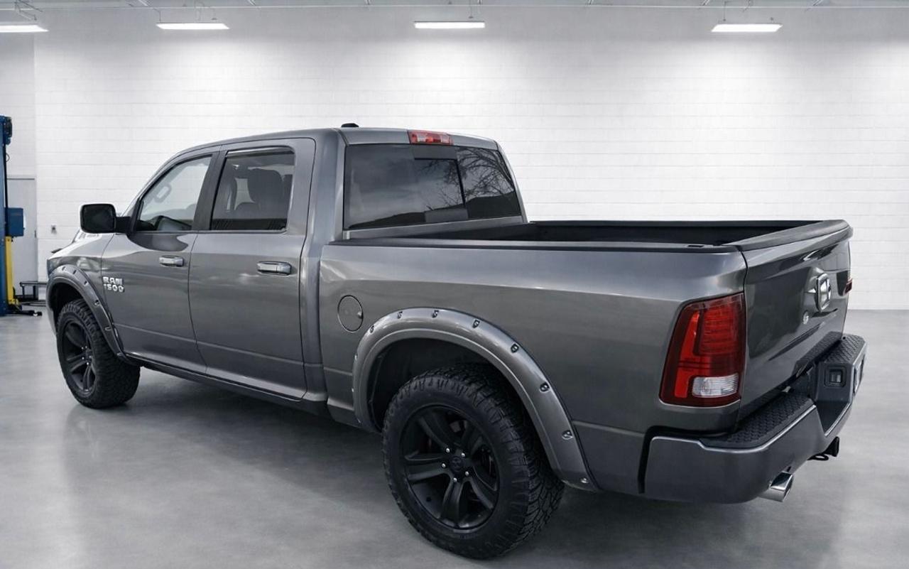 2013 RAM 1500 4WD Crew Cab 140.5" Sport Photo2