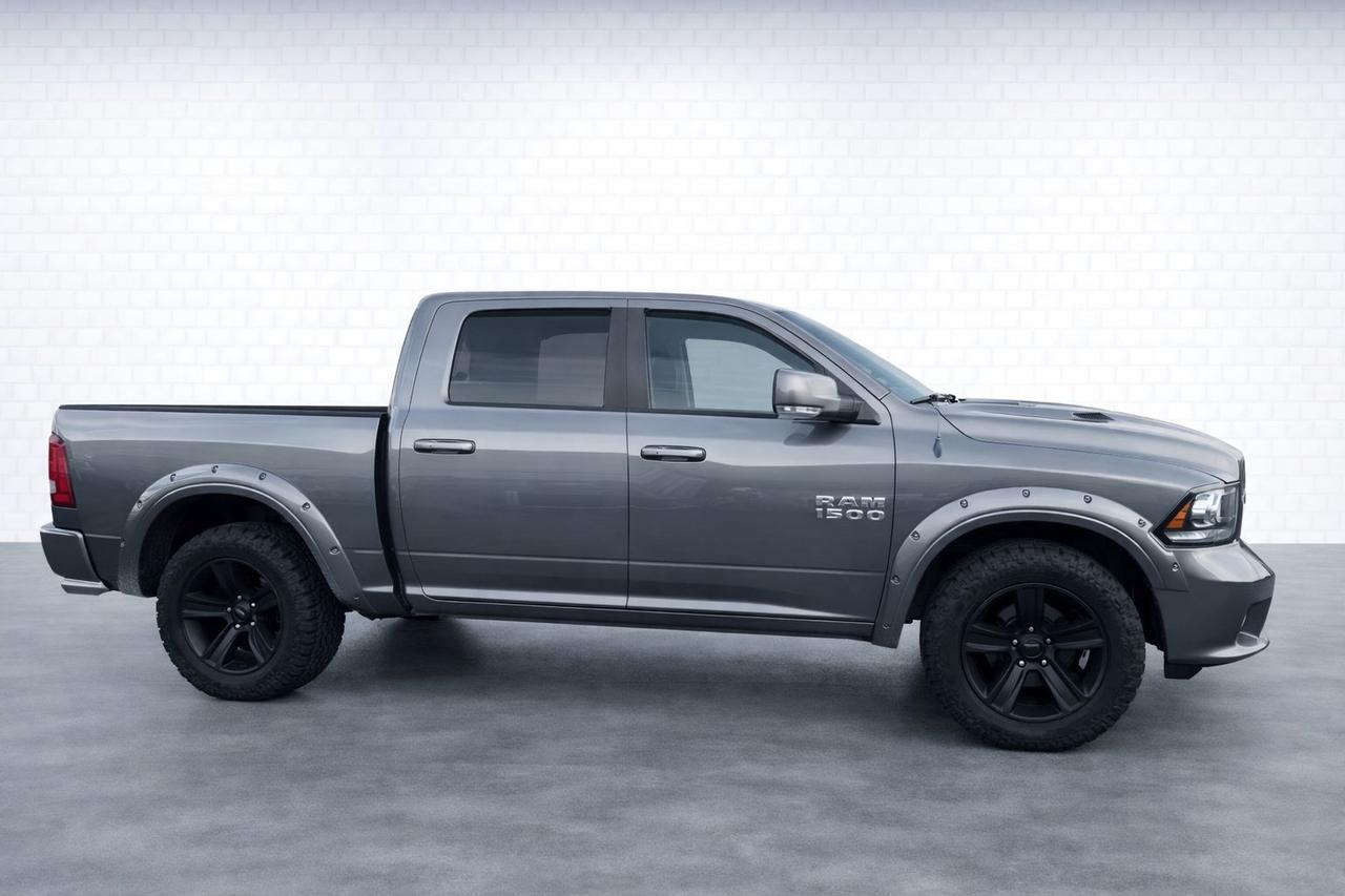 2013 RAM 1500 4WD Crew Cab 140.5" Sport Photo4