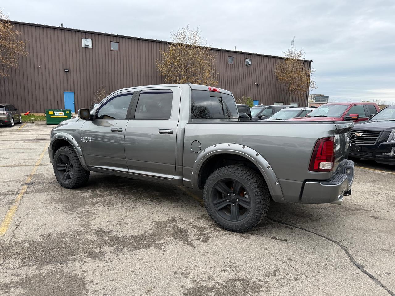 2013 RAM 1500 4WD Crew Cab 140.5" Sport 5.7L V8 Photo