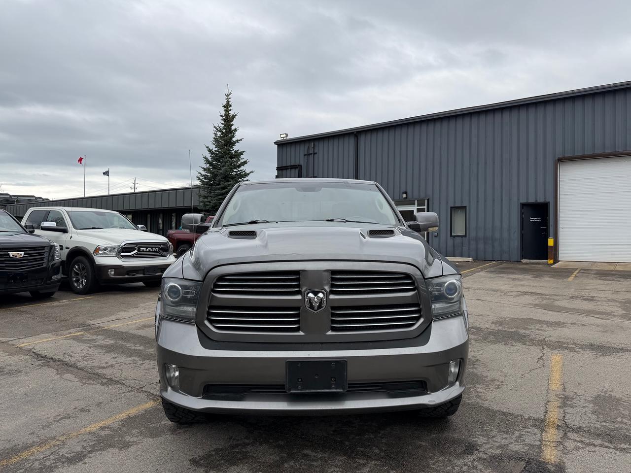 2013 RAM 1500 4WD Crew Cab 140.5" Sport 5.7L V8 Photo