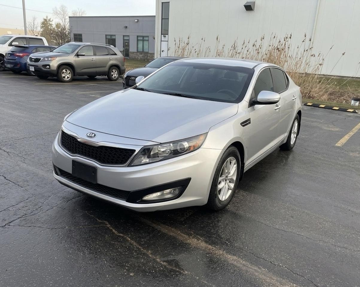 <p data-path-to-node=0>Financing Available | All Credit Types Welcome FREE 1-Year Engine & Transmission Warranty (Unlimited KMs included!) OMVIC & UCDA Certified Dealer &mdash; Verma Motors Inc.</p><p data-path-to-node=1><strong data-path-to-node=1 data-index-in-node=0>Price: $7,999 AS IS + HST</strong> (Safety Certification available for an additional $499)</p><p data-path-to-node=2><strong data-path-to-node=2 data-index-in-node=0>2013 Kia Optima 4dr Sdn</strong></p><p data-path-to-node=3><em data-path-to-node=3 data-index-in-node=0>Incredible value! This Optima offers very low mileage, sleek styling, and excellent fuel economy.</em></p><p data-path-to-node=4><strong data-path-to-node=4 data-index-in-node=0>Top Features:</strong></p><ul data-path-to-node=5><li><p data-path-to-node=5,0,0><strong data-path-to-node=5,0,0 data-index-in-node=0>Mileage:</strong> Very Low KMs! (Only 108k)</p></li><li><p data-path-to-node=5,1,0><strong data-path-to-node=5,1,0 data-index-in-node=0>Engine:</strong> Reliable 2.4L 4-Cylinder.</p></li><li><p data-path-to-node=5,2,0><strong data-path-to-node=5,2,0 data-index-in-node=0>Interior:</strong> Spacious, Premium Seating.</p></li><li><p data-path-to-node=5,3,0><strong data-path-to-node=5,3,0 data-index-in-node=0>Tech:</strong> Bluetooth Connectivity & AM/FM/CD Audio.</p></li><li><p data-path-to-node=5,4,0><strong data-path-to-node=5,4,0 data-index-in-node=0>Comfort:</strong> AC, Cruise Control, Power Windows & Locks.</p></li></ul><p data-path-to-node=6><strong data-path-to-node=6 data-index-in-node=0>Status:</strong></p><ul data-path-to-node=7><li><p data-path-to-node=7,0,0>108k Kilometers</p></li><li><p data-path-to-node=7,1,0>Very Low Mileage</p></li><li><p data-path-to-node=7,2,0>Well-Maintained & Clean</p></li><li><p data-path-to-node=7,3,0>Non-Smoker Interior</p></li></ul><p data-path-to-node=8><strong data-path-to-node=8 data-index-in-node=0>Viewing by Appointment Only</strong></p><p data-path-to-node=9><strong data-path-to-node=9 data-index-in-node=0>Call or Text Kapil:</strong> 437-766-1844 <strong data-path-to-node=9 data-index-in-node=33>Location:</strong> 9074 Wellington Rd 124, Hillsburgh, ON N0B 1Z0</p>