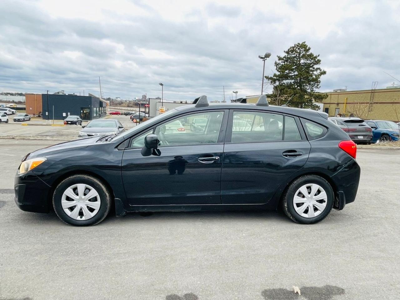 2014 Subaru Impreza 2.0i 4dr All-wheel Drive Sedan CVT Photo