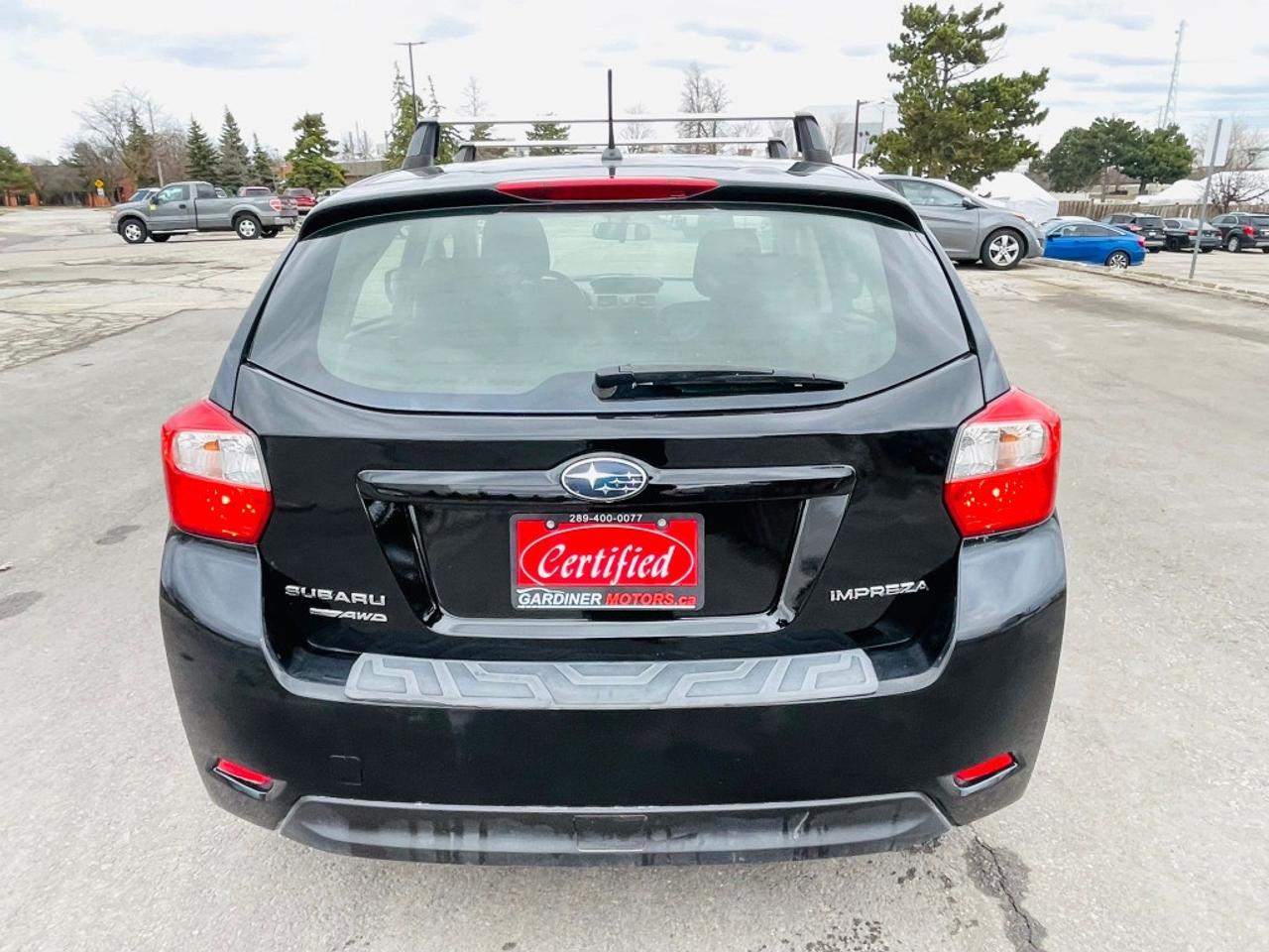 2014 Subaru Impreza 2.0i 4dr All-wheel Drive Sedan CVT Photo