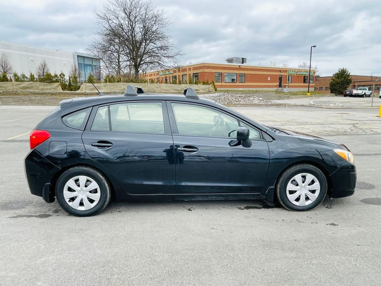 2014 Subaru Impreza 2.0i 4dr All-wheel Drive Sedan CVT Photo