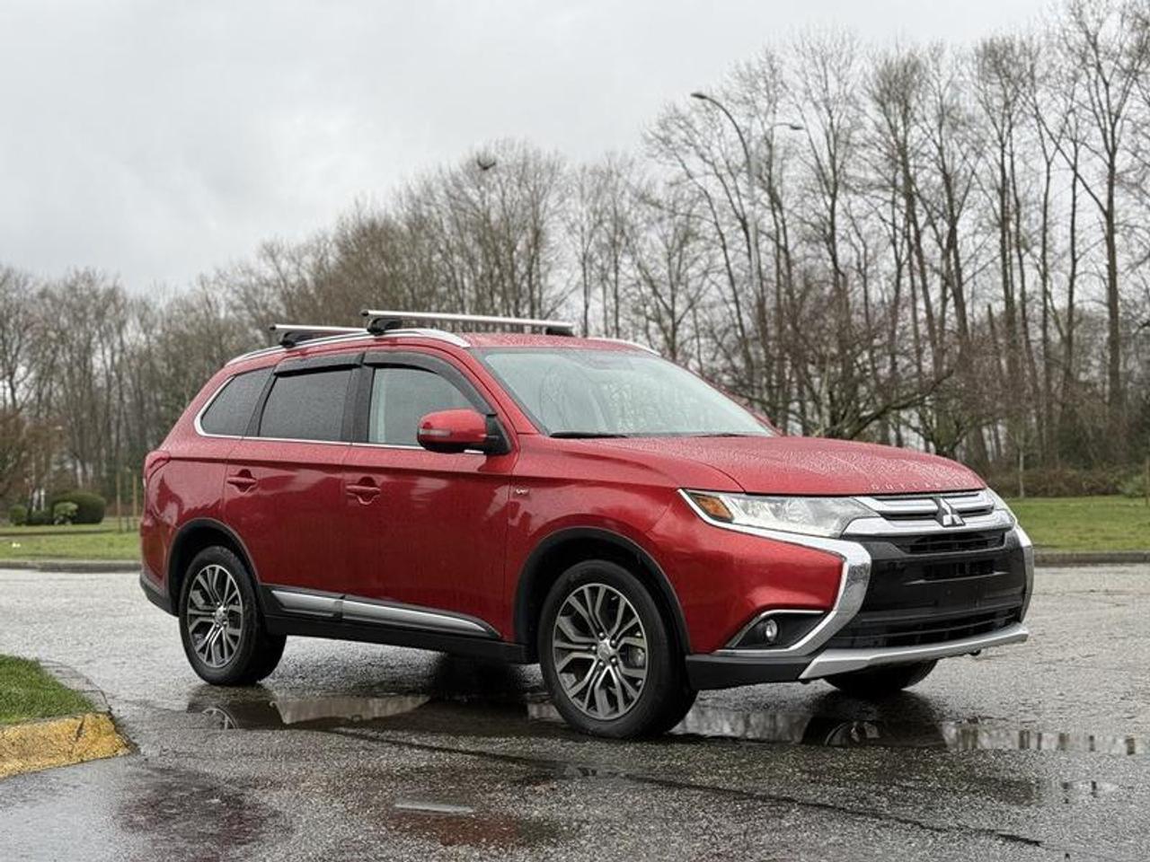 This 2016 Mitsubishi Outlander V6 AWC is powered by a 3.0L V6 paired with an automatic transmission and Mitsubishis All-Wheel Control (AWC) all-wheel drive system. It features 4-wheel ABS, adaptive cruise control, lane keep assist, and pre-collision warning for added driver support. The interior includes leather seating with heated front seats, power rear liftgate, sunroof, Bluetooth connectivity, AM/FM/XM radio with CD player, paddle shifters, and power windows, power door locks, and power mirrors. Finished in red with a black leather interior and equipped with a roof rack, this four-door SUV offers a comfortable and well-equipped setup suitable for daily driving or family use. This item is currently OFFSITE. You must register an appointment with our office to schedule an offsite viewing. Appointments must be made a minimum of one business day in advance (and as defined by the days that Repo.com is open for business) before your appointment can be scheduled and confirmed. We may, at our own discretion, instead opt to transport smaller items to Repo.coms main yard for viewing purposes.  $15,830.00 plus $375 processing fee, $16,205.00 total payment obligation before taxes.   Listing report, warranty, contract commitment cancellation fee, financing available on approved credit (some limitations and exceptions may apply). All above specifications and information is considered to be accurate but is not guaranteed and no opinion or advice is given as to whether this item should be purchased. We do not allow test drives due to theft, fraud, acts of vandalism and undetectable impaired driving. Instead we provide the following benefits: Complimentary Warranty (with options to extend), Limited Money Back Satisfaction Guarantee on Fully Completed Contracts, Contract Commitment Cancellation, and an Open-Ended Sell-Back Option. Ask seller for details or call 604-522-REPO(7376) to confirm listing availability.