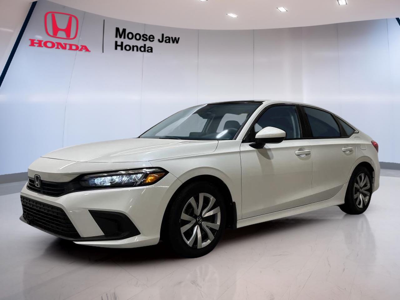 The 2022 Honda Civic Sedan LX is a smart compact car with a strong reputation for value, comfort, and daily ease. This used sedan at Moose Jaw Honda has 239,223 km and pairs Honda reliability with a smooth Continuously Variable transmission and efficient front-wheel drive.

Powered by a 2.0L I-4 DOHC 16-valve i-VTEC engine with port injection, the 2022 Honda Civic Sedan LX delivers steady power and excellent fuel-saving potential. Its refined ride, balanced handling, and practical four-door layout make it a solid fit for commuting, errands, and highway travel around Moose Jaw.

FEATURES OF THE Civic Sedan LX

»» 2.0L i-VTEC four-cylinder engine
»» Continuously Variable transmission for smooth driving
»» Front-wheel drive for confident traction
»» Practical sedan design with four doors

ADVANCED SAFETY FEATURES

»» Advanced airbag system for occupant protection
»» Vehicle Stability Assist helps maintain control
»» Anti-lock braking system supports safer stops
»» Traction control aids slippery road starts

PERFORMANCE AND EFFICIENCY

»» 2.0L engine balances power and economy
»» Continuously Variable transmission shifts very smoothly
»» Front-wheel drive supports everyday efficiency
»» Tuned suspension offers composed road manners

COMFORT AND CONVENIENCE

»» Spacious cabin for daily driving comfort
»» Four-door access helps passenger entry
»» Easy controls support simple operation
»» Sedan layout suits commuting and errands

TECHNONOLGY AND CONNECTIVITY

»» Clear driver display keeps information visible
»» User-friendly controls reduce daily distraction
»» Modern cabin layout feels well organized
»» Practical interface supports everyday usability

CARGO SPACE

»» Trunk suits groceries and travel bags
»» Sedan design keeps cargo area secure
»» Rear seat area adds versatility
»» Wide opening helps loading larger items

AWARDS & RECOGNITIONS

»» North American Car of the Year, 2022
»» Best Small Car, Automobile Journalists Association of Canada, 2022
»» Top Safety Pick, Insurance Institute for Highway Safety, 2022

WHAT OTHER OWNERS LIKE

»» Smooth ride quality for daily travel
»» Strong fuel economy from 2.0L engine
»» Easy-to-use controls and cabin layout
»» Comfortable interior with useful space

The 2022 Honda Civic Sedan LX stands out with mature styling, a roomy interior, and a driving feel that is more refined than many compact sedans. Its proven powertrain is designed for dependable use, while the Continuously Variable transmission helps keep the drive quiet and efficient in city and highway conditions.

For drivers shopping for a used compact sedan in Moose Jaw, the 2022 Honda Civic Sedan LX offers the essentials that matter most. It is practical, efficient, and easy to live with, making it a smart choice for students, commuters, and families who want trusted Honda engineering in a well-rounded package.

This 2022 Honda Civic Sedan LXs VIN is: 2HGFE2F25NH108182.<p>223 km and pairs Honda reliability with a smooth Continuously Variable transmission and efficient front-wheel drive.

Powered by a 2.0L I-4 DOHC 16-valve i-VTEC engine with port injection</p>
<p> the 2022 Honda Civic Sedan LX delivers steady power and excellent fuel-saving potential. Its refined ride</p>
<p> and highway travel around Moose Jaw.

FEATURES OF THE Civic Sedan LX

»» 2.0L i-VTEC four-cylinder engine
»» Continuously Variable transmission for smooth driving
»» Front-wheel drive for confident traction
»» Practical sedan design with four doors

ADVANCED SAFETY FEATURES

»» Advanced airbag system for occupant protection
»» Vehicle Stability Assist helps maintain control
»» Anti-lock braking system supports safer stops
»» Traction control aids slippery road starts

PERFORMANCE AND EFFICIENCY

»» 2.0L engine balances power and economy
»» Continuously Variable transmission shifts very smoothly
»» Front-wheel drive supports everyday efficiency
»» Tuned suspension offers composed road manners

COMFORT AND CONVENIENCE

»» Spacious cabin for daily driving comfort
»» Four-door access helps passenger entry
»» Easy controls support simple operation
»» Sedan layout suits commuting and errands

TECHNONOLGY AND CONNECTIVITY

»» Clear driver display keeps information visible
»» User-friendly controls reduce daily distraction
»» Modern cabin layout feels well organized
»» Practical interface supports everyday usability

CARGO SPACE

»» Trunk suits groceries and travel bags
»» Sedan design keeps cargo area secure
»» Rear seat area adds versatility
»» Wide opening helps loading larger items

AWARDS & RECOGNITIONS

»» North American Car of the Year</p>
<p> 2022

WHAT OTHER OWNERS LIKE

»» Smooth ride quality for daily travel
»» Strong fuel economy from 2.0L engine
»» Easy-to-use controls and cabin layout
»» Comfortable interior with useful space

The 2022 Honda Civic Sedan LX stands out with mature styling</p>
<p> and a driving feel that is more refined than many compact sedans. Its proven powertrain is designed for dependable use</p>
<p> while the Continuously Variable transmission helps keep the drive quiet and efficient in city and highway conditions.

For drivers shopping for a used compact sedan in Moose Jaw</p>
<p> and families who want trusted Honda engineering in a well-rounded package.

This 2022 Honda Civic Sedan LXs VIN is: 2HGFE2F25NH108182.</p>