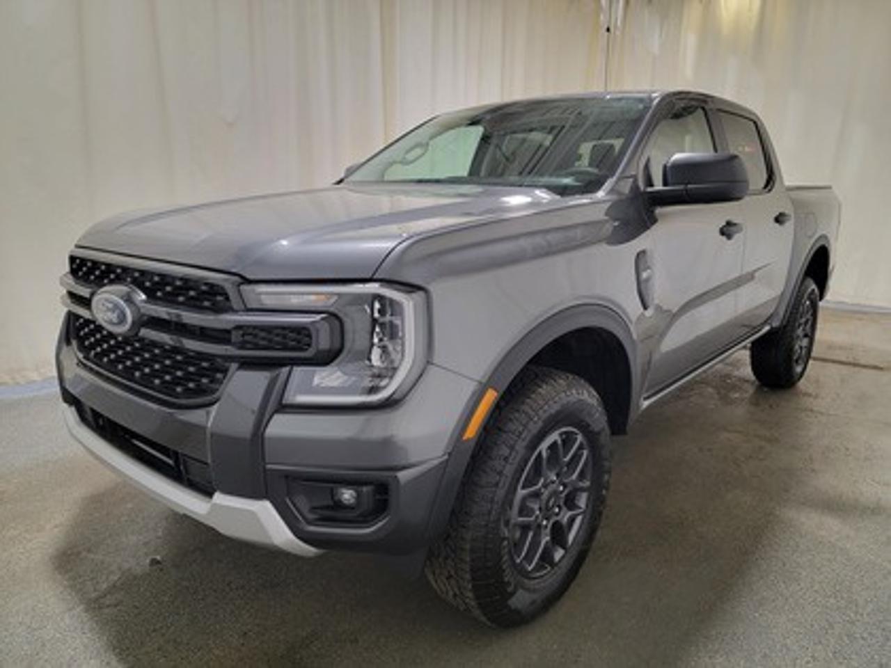 This all-new 2026 Ford Ranger XLT 301A looks absolutely stunning in Carbonized Grey Metallic. This versatile compact pickup comes equipped with the 2.7L EcoBoost® engine, producing 315 horsepower and 400 lb-ft of torque. By leveraging EcoBoost® technology and a 10-speed automatic transmission, this truck is designed to achieve 11.6L/100 km (24 miles per gallon) combined highway/city fuel economy.

This vehicle comes with the All-Weather Packageready to take on any season! 

Snow, rain, mud, or sunshinethis vehicle is built for it all! The All-Weather Package adds extra protection where it matters most, with premium mud flaps to shield your paint from road debris, all-weather floor mats to protect your interior from lifes messes, and Xpel paint protection to help guard against those infuriating rock chips. Drive with confidence, knowing your investment is protected from Regina's elements. 

Key Features:
12 Centre Display
Dual Zone Temperature Control 
Rear Window W/Privacy Glass & Defrost
Ford Co-Pilot360
Rear View Camera
Lane Keeping System 
Rear Parking Sensors
Reverse Break Assist 
10-Way Power Drivers Seat 
Heated Front Seats 
17 Grey Painted Aluminum Wheels
Cruise Control
FordPass Connect
Selectable Drive Modes
8 Cluster Display
FX4 Off-Road Package

The 2026 Ranger XLT is built to handle Saskatchewans diverse driving conditions, offering both fuel efficiency and practical utility features like multiple Drive Modes: Normal, Eco, Sport, Tow/Haul, Slippery mode, Trailer Towing abilities, Auto highbeam headlamps and cruise control. 

Bennett Dunlop Ford, proudly serving Regina for over 40 years, is conveniently located at 770 Broad Street. With over 3,500 Google reviews, our reputation reflects our commitment to providing a fast, easy, and enjoyable vehicle-buying experience. We eliminate the hassle with no admin or documentation fees, transparent upfront pricing that lets you shop with total confidence. But were more than just a dealershipwere driven to make a difference by supporting local community initiatives and events that matter to you. Visit Bennett Dunlop Ford today and experience why were Reginas trusted choice for quality vehicles, exceptional service, and a genuine commitment to driving change in our community!