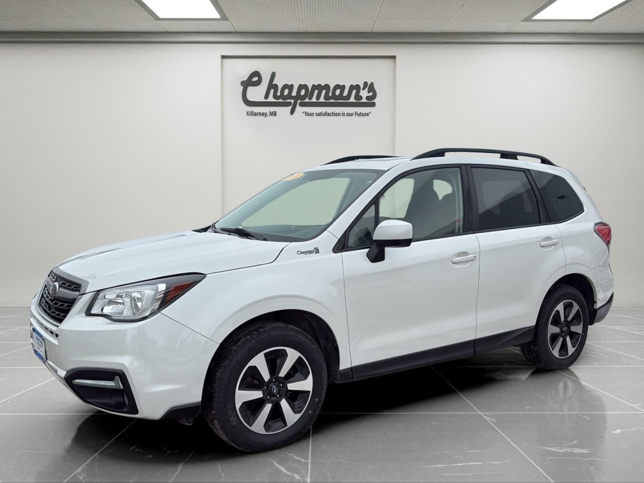<p><strong>2 Sets of Tires Included!</strong></p><p>Practical, reliable, and built for Canadian conditions, this <strong>2018 Subaru Forester 2.5i Touring</strong> finished in <strong>Crystal White Pearl with a comfortable black interior</strong> delivers the versatility and confidence Subaru is known for. With its elevated ride height, spacious interior, and legendary <strong>Symmetrical All-Wheel Drive</strong>, this Forester is ready for everything from daily commutes to weekend adventures.</p><p>Powered by a dependable <strong>2.5L 4-cylinder BOXER engine paired with a smooth CVT transmission</strong>, the Forester offers a balanced mix of efficiency and capability. Subarus <strong>full-time AWD system and X-Mode traction control</strong> provide excellent grip in snow, gravel, and changing road conditions, making it a great fit for year-round driving.</p><h3><strong>Performance & Capability</strong></h3><p>Confident all-weather performance with Subaru reliability.</p><ul><li><p>2.5L BOXER 4-Cylinder Engine</p></li><li><p>CVT Automatic Transmission with Manual Mode</p></li><li><p>Symmetrical All-Wheel Drive</p></li><li><p>Hill Descent Control</p></li><li><p>Independent Suspension System</p></li><li><p>17" Aluminum Alloy Wheels</p></li><li><p>60L Fuel Tank</p></li></ul><h3><strong>Interior Comfort & Convenience</strong></h3><p>Spacious interior designed for comfort and versatility.</p><ul><li><p>Heated Front Seats</p></li><li><p>10-Way Power Driver Seat with Lumbar Support</p></li><li><p>Dual-Zone Automatic Climate Control</p></li><li><p>Panoramic Power Sunroof</p></li><li><p>60/40 Split Folding Rear Seats</p></li><li><p>Tilt & Telescoping Steering Wheel</p></li><li><p>Cruise Control</p></li><li><p>Cargo Cover & Underfloor Storage</p></li></ul><h3><strong>Technology & Connectivity</strong></h3><p>Essential technology for everyday convenience.</p><ul><li><p>Subaru Infotainment System</p></li><li><p>Bluetooth Connectivity</p></li><li><p>Steering Wheel Audio Controls</p></li><li><p>Driver Information Centre</p></li><li><p>USB & 12V Power Outlets</p></li></ul><h3><strong>Safety & Driver Assistance</strong></h3><p>Subaru safety features designed for peace of mind.</p><ul><li><p>Rear Vision Camera</p></li><li><p>Blind Spot Monitoring</p></li><li><p>Rear Cross Traffic Alert</p></li><li><p>Stability & Traction Control</p></li><li><p>Advanced Airbag System</p></li><li><p>Child Safety Locks</p></li></ul><h3><strong>Exterior Highlights</strong></h3><p>Functional design with rugged Subaru styling.</p><ul><li><p>Crystal White Pearl Exterior</p></li><li><p>Panoramic Glass Sunroof</p></li><li><p>Heated Power Side Mirrors</p></li><li><p>Roof Rails</p></li><li><p>Front Fog Lamps</p></li><li><p>Rear Spoiler</p></li><li><p>All-Season Tires</p></li></ul><p>With legendary Subaru AWD capability, a spacious and versatile interior, and dependable performance, this <strong>2018 Subaru Forester 2.5i Touring</strong> is a smart choice for drivers who need a practical SUV thats ready for all seasons and all adventures.</p><p>Price Includes Dealer Fee.</p><p>Price Excludes PST & GST.</p><p>Financing Options Available, Call For More Details.</p> <p><strong>*While every reasonable effort is made to ensure the accuracy of this information, we are not responsible for any error or omissions contained on these pages. Please verify any information in question with Chapman Motors Ltd.</strong></p>