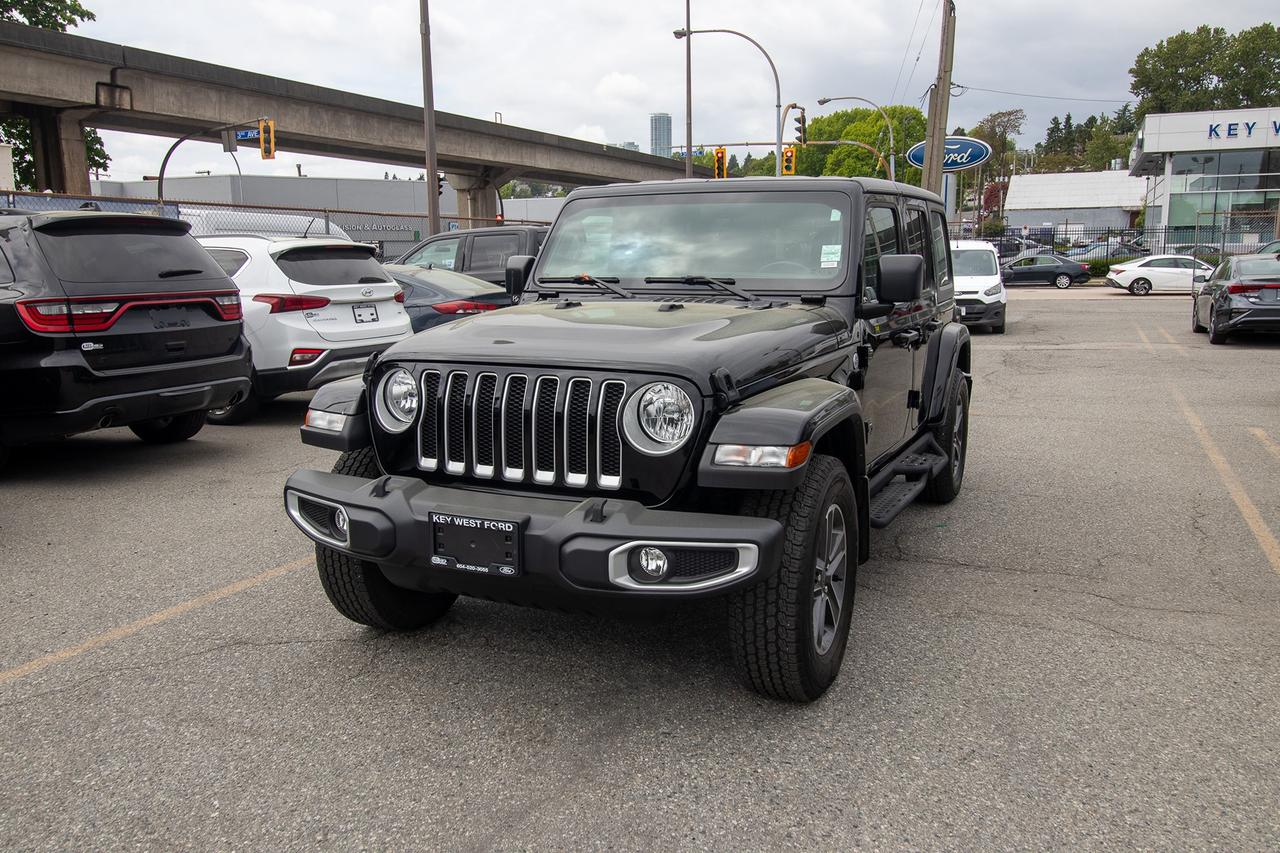 <p>Embark on your next adventure with this striking black 2023 Jeep Wrangler Sahara, now available at Key West Ford. This rugged yet refined SUV is built for those who crave both capability and comfort, offering an iconic design that turns heads wherever you go. With a robust gasoline engine paired with a smooth automatic transmission and a legendary 4-wheel drive system, this Wrangler is ready to tackle any terrain, from city streets to challenging off-road trails. Its four-door configuration provides ample space for passengers and cargo, making it the perfect companion for weekend getaways or daily commutes. With a mere 49,160 kilometers on the odometer, this Sahara is just getting started and eager to explore.</p><p>Key West Ford is proud to present a 2023 Jeep Wrangler Sahara that embodies the spirit of freedom and adventure. This four-door SUV, finished in a sleek black exterior, boasts a suite of features designed to elevate your driving experience. Whether youre navigating urban landscapes or venturing into the great Canadian wilderness, the Wrangler Sahara offers a commanding presence and unwavering performance. Its gasoline-powered engine delivers reliable power, while the automatic transmission ensures seamless gear changes, and the 4-wheel drive system provides exceptional traction in all conditions. This particular Sahara has been well-maintained, with only 49,160 kilometers showing on the odometer.</p><p>Here are 5 sizzling features of this 2023 Jeep Wrangler Sahara:</p><ul><li><strong>Iconic 4x4 Capability:</strong> Conquer any trail with Jeeps legendary 4-wheel drive system, engineered to deliver unparalleled off-road prowess and confidence in every driving situation.</li><li><strong>Sahara Trim Excellence:</strong> Experience a blend of ruggedness and refinement with the Sahara trim, offering premium touches and enhanced comfort for both daily driving and adventurous excursions.</li><li><strong>Striking Black Exterior:</strong> Command attention with the classic and sophisticated black exterior paint, exuding a timeless style that perfectly complements the Wranglers bold design.</li><li><strong>Spacious 4-Door Configuration:</strong> Enjoy versatile practicality with the four-door body style, providing generous passenger room and ample cargo space for all your gear and adventures.</li><li><strong>Low Kilometers:</strong> With only 49,160 km on the clock, this 2023 Wrangler Sahara has plenty of life left to offer, ready to embark on countless new journeys with you.</li></ul><p><strong><em>Powered by AutoIntelligence&trade;</em></strong></p><p>Vehicle information has been generated using artificial intelligence and is provided for informational purposes only. While efforts are made to ensure accuracy, please confirm all details directly with the dealer.</p><p>Experience peace of mind with our Buy With Confidence program! This vehicle comes with a comprehensive mechanical and safety inspection, Carfax report, and full disclosure. We are committed to transparent pricing. The advertised price excludes fees: $699 Documentation, $349 Registration/Insurance Transfer, $695 Finance Administration Fee (if applicable), and taxes. As BCs #1 Volume Dealer and #1 for Customer Experience on DealerRater, we prioritize your satisfaction. See Key West Ford for complete details. Book your test drive today!&nbsp; Dealer #7485</p>