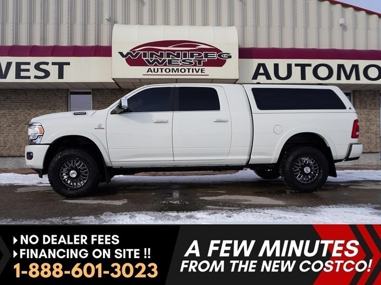 *** Dealer arranged financing on site! Quick, Simple,  no calls or waiting on bank appointments required!! Drive away today ***   NO ADMINISTRATION FEES!!

Ultra premium MEGA cab!!  ABSOLUTE TOP OF THE LINE ** LIMITED LONGHORN!! ** 
Not your average Diesel truck! This is an extremely high end ultra luxurious truck with far over 10 thousand dollars of OEM factory upgrades and options!! Immaculate throughout. Scroll through the picture portfolio to view the impressive options as well as the impeccable condition throughout!! 

Heavy Duty capability - unparalleled luxury &ndash; massive interior space &ndash; Pearl White Exterior over rich Black and Cattle Tan Longhorn  &lsquo;genuine&rsquo;  leather interior &ndash; every conceivable high end option and accessory ( far too many to list ) &ndash; Sport bucket and console package &ndash; Large 12 inch touch screen media center &ndash; color matched sleek LEER Truck cap &ndash; Heavy Duty spray in Rhino Liner &ndash; After Market Good Year Wrangler  Duratracs  over Machined Black and Satin XF Off Road Alloys!! (all included in advertised price) 

Features & Highlights
- 4X4 with electronic shift on the fly transfer case
- 12-inch Uconnect 5 NAV touchscreen
- 17-speaker harman/kardon premium sound system
- Wireless charging pad
- Google Android Auto and Apple CarPlay
- 4G LTE Wi-Fi hotspot capability
- Blind Spot and Cross Path Detection
- ParkSense front and rear park assist
- ParkView backup camera
- Remote proximity keyless entry with push button start
- Remote start system
- Power adjustable pedals with memory
- Heated and ventilated front leather bucket seats
- Heated steering wheel
- Heated second row seats
- Dual zone automatic climate control
- Rain sensing windshield wipers
- LED projector headlamps, LED fog lights and LED taillamps
- Class V hitch receiver with 4 and 7 pin wiring
- Trailer sway control and hill start assist
- Anti spin rear differential
- Heavy Duty Snowplow Prep Group
- Mopar spray in bedliner
- 20" polished aluminum wheels with all terrain tires
- Bright tow hooks and clearance lamps

LUXURY MEETS TRUE HEAVY-DUTY PERFORMANCE!! This Longhorn stands out not only for its luxury interior and technology, but also for being properly equipped for serious work. The Cummins diesel platform, heavy duty towing equipment, and snowplow prep capability make it a versatile truck whether used for business, recreation, or long-distance hauling.

If you are looking for a premium diesel Mega Cab with massive interior space, top level comfort, and real towing capability, this RAM 2500 Longhorn is an exceptional option. Trucks with this level of equipment, presence, and Cummins power do not stay available for long. This is truly a truck you need to come down and see in person to fully appreciate, from the upscale Longhorn interior to the commanding stance and capability. DO NOT WAIT. COME SEE IT TODAY!!!!

Comes with a Manitoba Safety Certification, and we have many Extended Powertrain warranties available on your vehicle purchase up to 10-year coverage (on eligible vehicles see dealer for details). Financing on site with Zero down financing OAC. Trades accepted. View at Winnipeg West Automotive Group, 5195 Portage Ave. (only a couple of minutes past the new Costco) Dealer permit # 6007, Call now 1(888) 601-3023. This Car is located in Winnipeg Manitoba, however we can have it shipped anywhere in North America relatively inexpensively.Comes with a Manitoba Safety Certification, and we have many Extended Powertrain warranties available on your vehicle purchase up to 10-year coverage (on eligible vehicles see dealer for details). Financing on site with Zero down financing OAC. Trades accepted. View at Winnipeg West Automotive Group, 5195 Portage Ave. (only a couple of minutes past the new Costco) Dealer permit # 6007, Call now 1(888) 601-3023. This Car is located in Winnipeg Manitoba,  however we can have it shipped anywhere in North America relatively inexpensively.