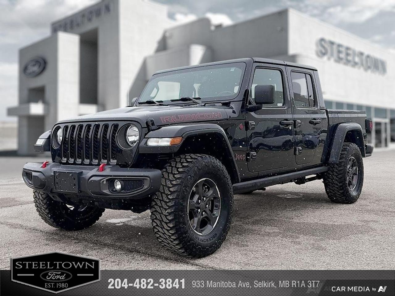 <b>Heavy Duty Suspension,  Sunroof,  Premium Audio,  Navigation,  Climate Control!</b><br> <br> We value your TIME, we wont waste it or your gas is on us!   We offer extended test drives and if you cant make it out to us we will come straight to you!<br><br><br> <br>Ever wished your truck had a big open cabin like a Jeep? Ever wished your Jeep could hold more than a few people and a backpack? Now it can thanks to this awesome Jeep Gladiator! This 2023 Jeep Gladiator is for sale today in Selkirk.<br> <br>Built with unmistakable Jeep styling and off-road capability and the capability and hauling power of a pickup truck, you get the best of both worlds with this incredible machine. Thanks to its unmistakable style, rugged off-road technology, and an exhilarating open air truck experience, this unique Jeep Gladiator is ready to change the 4X4 game.<br> <br>This Regular Cab 4X4 pickup has 57,241 km. Its Black in colour and is completely accident free based on the <a href=https://vhr.carfax.ca/?id=IyhSIILVv5km0iSUPAKve58vidHHuhtq target=_blank>CARFAX Report</a>. It has an Automatic transmission and is powered by a 285HP 3.6L V6 Cylinder Engine. <br> <br> Our Gladiators trim level is Rubicon. Sitting at the top of the Gladiator range, this Rubicon trim is fully loaded with FOX premium dampers, 7 skid plates, heavy-duty suspension, a manual Targa composite first-row sunroof, a 9-speaker Alpine premium audio setup, voice-activated navigation, dual-zone climate control, class III towing equipment with a trailer wiring harness and trailer sway control, a full-size spare with underbody storage, removable doors and windows, and a manual convertible top with fixed roll-over protection. This rugged truck also features great convenience features like proximity keyless entry with push button start, illuminated front and rear cupholders, two 12-volt DC and a 120-volt AC power outlets, and tons of storage space. Handling infotainment and connectivity duties is an 8.4-inch screen powered by Uconnect 4, and features Apple CarPlay, Android Auto, 4G LTE WiFi hotspot internet access, and streaming audio. This vehicle has been upgraded with the following features: Heavy Duty Suspension, Sunroof, Premium Audio, Navigation, Climate Control, Apple CarPlay, Android Auto.<br> To view the original window sticker for this vehicle view this <a href=http://www.chrysler.com/hostd/windowsticker/getWindowStickerPdf.do?vin=1C6JJTBG1PL532290 target=_blank>http://www.chrysler.com/hostd/windowsticker/getWindowStickerPdf.do?vin=1C6JJTBG1PL532290</a>. <br/><br> <br>To apply right now for financing use this link: <a href=http://www.steeltownford.com/?https://CreditOnline.dealertrack.ca/Web/Default.aspx?Token=bf62ebad-31a4-49e3-93be-9b163c26b54c&La target=_blank>http://www.steeltownford.com/?https://CreditOnline.dealertrack.ca/Web/Default.aspx?Token=bf62ebad-31a4-49e3-93be-9b163c26b54c&La</a><br> <br/>Buy this vehicle now for the lowest bi-weekly payment of <b>$307.62</b> with $0 down for 96 months @ 8.99% APR O.A.C. ( Plus applicable taxes - Platinum Shield Protection & Tire Warranty included / Total cost of borrowing $18411 ). See dealer for details. <br><br>Family owned and operated in Selkirk for 35 Years.  <br>Steeltown Ford is located just 20 minutes North of the Perimeter Hwy, with an onsite banking center that offers free consultations. <br>Ask about our special dealer rates available through all major banks and credit unions.<br><br><br>Steeltown Ford Protect Plus includes:<br>- Life Time Tire Warranty <br>Cars cost less in Selkirk <br><br>Dealer Permit # 1039<br><br><br> Come by and check out our fleet of 90+ used cars and trucks and 170+ new cars and trucks for sale in Selkirk.  o~o
