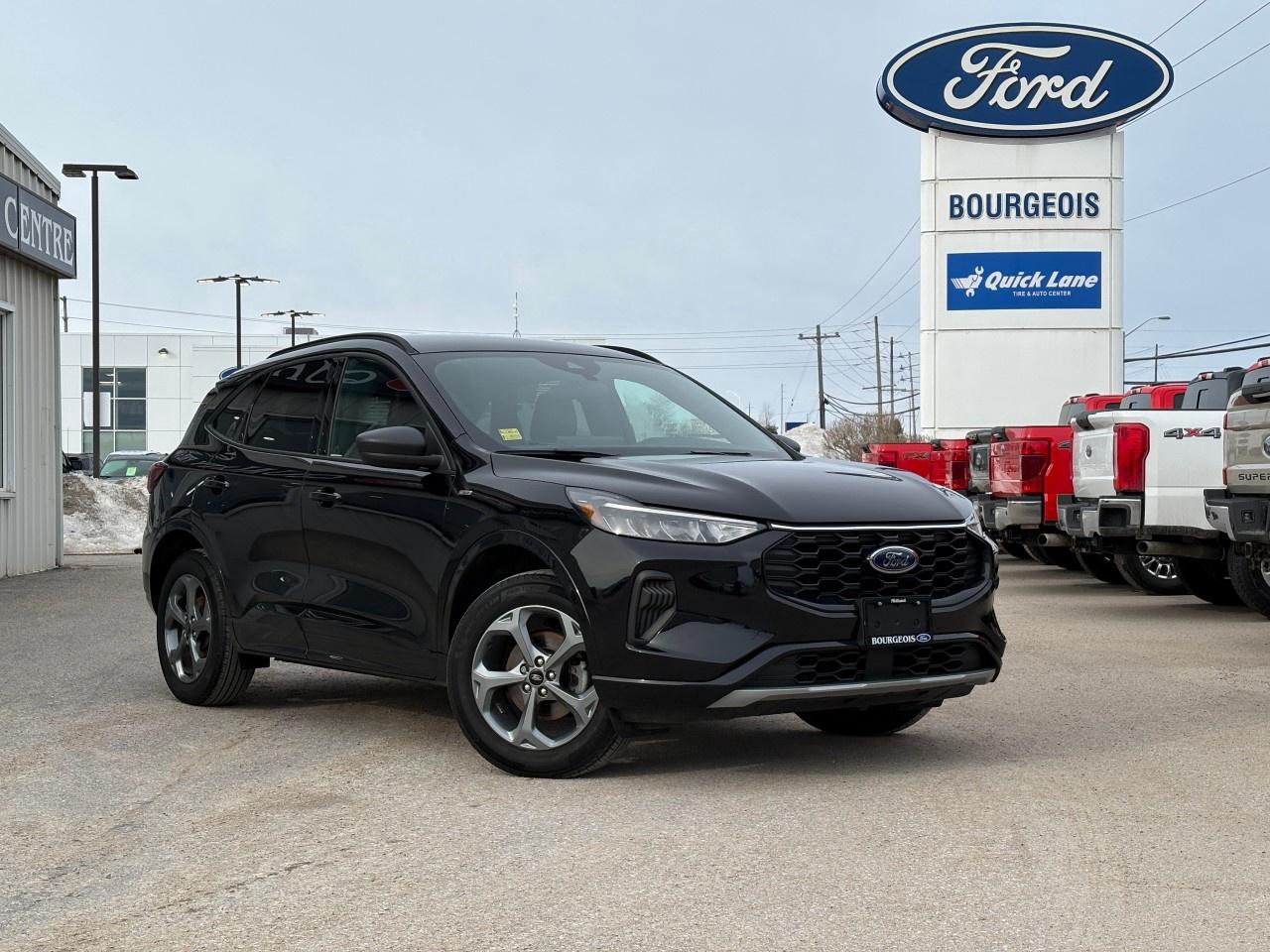 <p>The 2023 Ford Escape ST-Line AWD in sophisticated black is the ultimate package for those who crave both style and functionality in their drive. This SUV is designed to elevate every journey with its all-wheel-drive capabilities, ensuring smooth handling in all conditions.</p><p>The exterior sportiness of the black finish is paired with sleek alloy wheels, giving this vehicle a commanding presence on the road. Inside, the black interior creates a polished and inviting atmosphere. Customary features such as heated front row seats and a heated steering wheel offer optimal comfort for Canadian winters.</p><p>Equipped with a comprehensive range of technology, this Escape features smart device integration ensuring ultimate connectivity, a backup camera for enhanced safety, and a convenient remote start feature. You'll feel secure with advanced driver assistance features such as lane assist and brake assist, making each drive safe and enjoyable.</p><p>Perfectly suited for the modern adventurer or the on-the-go family, the Ford Escape ST-Line AWD is ready to meet your needs. Contact our dealership today to find out more and arrange a test drive to experience this incredible vehicle for yourself!</p>