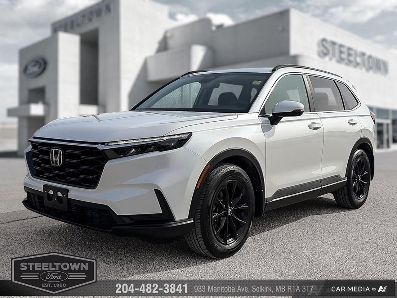 <b>Low Mileage, Sunroof,  Power Liftgate,  Heated Seats,  Heated Steering Wheel,  Apple CarPlay!</b><br> <br> We value your TIME, we wont waste it or your gas is on us!   We offer extended test drives and if you cant make it out to us we will come straight to you!<br><br><br> <br>This 2025 Honda CR-V is set to cause a stir in the crossover SUV segment. This 2025 Honda CR-V is for sale today in Selkirk. <br> <br>Hondas ubiquitous CR-V features a host of performance, design and technological upgrades to give it an even bigger edge against rivals in the ever-heated crossover SUV segment. With roomy seating, wide-open sightlines, and sporty details throughout, the interior of this CR-V makes it easy to settle in and enjoy the ride. Upgraded infotainment systems with even more active and passive safety systems ensure a serene and uncompromised ride in this SUV. This low mileage SUV has just 18,823 km. Its White in colour and is completely accident free based on the <a href=https://vhr.carfax.ca/?id=RZyEWjdcZK2sRJDy8c+0NVA47OW48W0A target=_blank>CARFAX Report</a>. It has an Automatic transmission and is powered by a 190HP 1.5L 4 Cylinder Engine. <br> <br> Our CR-Vs trim level is Sport. This CR-V Sport steps things up with an express open/close sunroof, a power liftgate for rear cargo access, and a heated leather steering wheel, along with upgraded 18-inch aluminum wheels. With an all-wheel-drive system, this incredibly versatile and practical SUV features heated front seats, 60-40 folding split-bench rear seats, proximity keyless entry with push button start, adaptive cruise control, dual-zone climate control, remote engine start, and a refreshed 7-inch infotainment system with Apple CarPlay, Android Auto and Siri Eyes Free. Safety features include blind spot detection, front and rear collision mitigation, front pedestrian braking, lane keeping assist with lane departure warning, driver monitoring alert, and a rear camera. Additional features include front and rear cupholders, LED headlights with automatic high beams, USB-A/USB-C charging ports, and even more. This vehicle has been upgraded with the following features: Sunroof, Power Liftgate, Heated Seats, Heated Steering Wheel, Apple CarPlay, Android Auto, Remote Start.<br> <br>To apply right now for financing use this link: <a href=http://www.steeltownford.com/?https://CreditOnline.dealertrack.ca/Web/Default.aspx?Token=bf62ebad-31a4-49e3-93be-9b163c26b54c&La target=_blank>http://www.steeltownford.com/?https://CreditOnline.dealertrack.ca/Web/Default.aspx?Token=bf62ebad-31a4-49e3-93be-9b163c26b54c&La</a><br><br> <br/><br>Family owned and operated in Selkirk for 35 Years.  <br>Steeltown Ford is located just 20 minutes North of the Perimeter Hwy, with an onsite banking center that offers free consultations. <br>Ask about our special dealer rates available through all major banks and credit unions.<br><br><br>Steeltown Ford Protect Plus includes:<br>- Life Time Tire Warranty <br>Cars cost less in Selkirk <br><br>Dealer Permit # 1039<br><br><br> Come by and check out our fleet of 110+ used cars and trucks and 150+ new cars and trucks for sale in Selkirk.  o~o