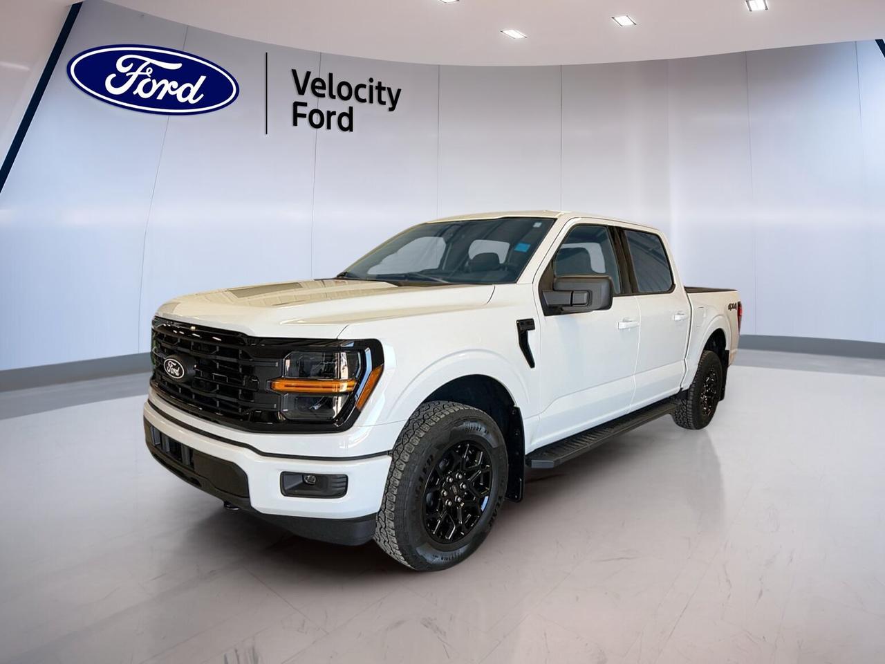 Built for work, family duty, and weekend adventure, this brand new 2026 Ford F-150 XLT 4WD SuperCrew 5.5 Box is ready for life in Moose Jaw. It pairs a proven 2.7 Litres unleaded engine with automatic transmission and four-wheel drive for confident year-round capability. The white exterior and black interior give this truck a clean, professional look.

FEATURES OF THE F-150 XLT 4WD SuperCrew 5.5 Box

»» Brand new full-size Ford pickup
»» Four-door SuperCrew cab adds versatility
»» 5.5-foot box supports daily hauling
»» XLT trim balances value and utility

TRUCK FEATURES

»» Towing capacity rated at 4,671 kg
»» Four-wheel drive adds all-season traction
»» Rear tow hook supports truck utility
»» Off-road tires aid rough-surface grip

ADVANCED SAFETY FEATURES

»» Backup camera helps with reversing
»» Blind spot monitor boosts lane awareness
»» Lane departure warning adds confidence
»» Side and head airbags enhance protection

PERFORMANCE AND EFFICIENCY

»» 2.7 Litres unleaded engine delivers power
»» Automatic transmission supports smooth shifting
»» Dual shift mode adds control
»» Power steering helps easy manoeuvres

COMFORT AND CONVENIENCE

»» Cruise control supports relaxed highway driving
»» Front air conditioning keeps cabin comfortable
»» Power windows add daily ease
»» Driver lumbar support improves comfort

TECHNONOLGY AND CONNECTIVITY

»» Bluetooth integration supports hands-free calling
»» WiFi hotspot keeps devices connected
»» Satellite radio expands entertainment choices
»» Steering wheel audio controls add convenience

CARGO SPACE

»» 5.5-foot box handles daily cargo
»» Rear trunk access aids loading ease
»» Four-door cabin adds flexible storage
»» Spare tire supports roadside readiness

WHAT OTHER OWNERS LIKE

»» Strong towing for work and play
»» Spacious SuperCrew cabin for families
»» User-friendly tech for daily driving
»» Confident four-wheel drive in winter

This brand new 2026 Ford F-150 XLT 4WD SuperCrew 5.5 Box at Velocity Ford gives you the strength and versatility Canadian truck buyers want. Its four-door layout makes it easy to carry passengers, while the short box remains practical for tools, gear, and home projects without feeling bulky in town.

This truck is equipped with many core features drivers use every day. Highlights include cruise control, heated mirrors, electric mirrors, power windows, tinted windows, automatic headlights, fog lights, rear window defroster, and automatic door locks. These practical details help make each trip easier, whether you are heading to work or leaving for a weekend away.

Inside, this 2026 Ford F-150 XLT 4WD SuperCrew 5.5 Box offers a smart and functional cabin with black interior trim, front air conditioning, an adjustable steering wheel, illuminated vanity mirrors, and steering wheel audio controls. Bluetooth integration, satellite radio, and a WiFi hotspot help keep you connected and entertained on the road.

Safety and driver support are also well covered. Anti-Lock Braking System, stability control, tire pressure monitoring, child safety locks, driver and passenger airbags, passenger airbag sensor, side impact airbags, head side airbags, blind spot monitor, lane departure warning, and a backup camera all help support peace of mind on every drive.

With its capable engine, automatic transmission, four-wheel drive system, and 4,671 kg towing capacity, this brand new pickup is prepared for demanding tasks in every season. If you want a full-size truck that blends proven capability, modern convenience, and everyday usability, this F-150 is a smart choice at Velocity Ford in Moose Jaw.

This 2026 Ford F-150 XLT 4WD SuperCrew 5.5 Boxs VIN is: 1FTEW3LP8TKD54646.