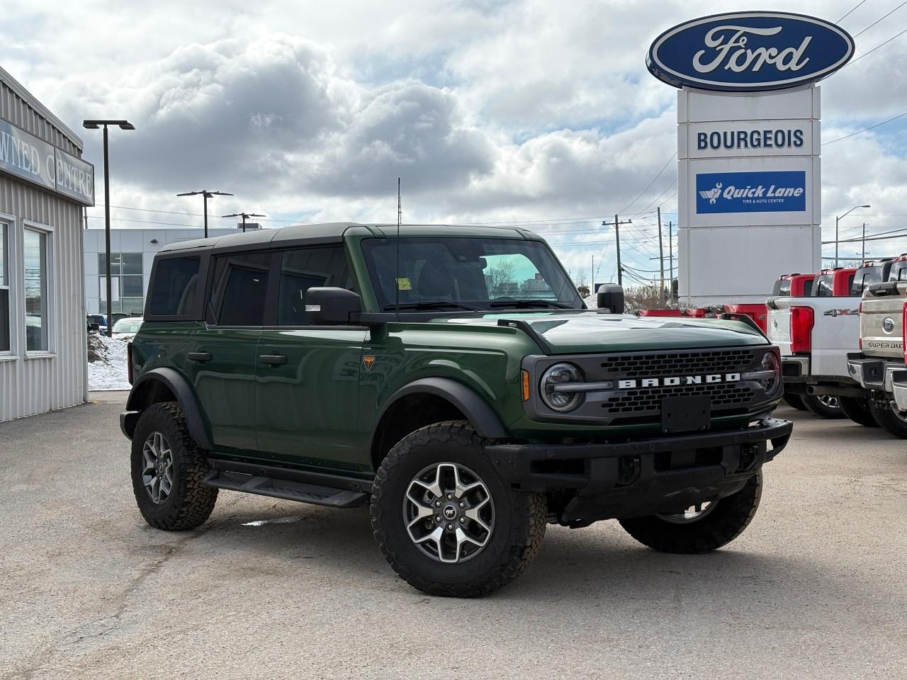 <p>The 2024 Ford Bronco Badlands, colored in a striking Green, brings you the ultimate off-road experience with its robust 4x4 drivetrain. This SUV is engineered to handle any adventure with ease.</p><p>The exterior's rugged design is complemented by its polished alloy wheels, while inside, the Black interior exudes a sense of sophistication with premium features such as heated seats and a leather steering wheel. Convenience is enhanced with smart device integration and a wi-fi hotspot, ensuring you stay connected wherever the journey takes you.</p><p>Equipped with modern technology including a backup camera and brake assist, the 2024 Bronco Badlands offers peace of mind with every drive. Driver assistance features like cruise control and keyless entry further enhance the driving experience while the automatic transmission ensures seamless transitions on different terrains.</p><p>Perfect for the adventurers and families seeking versatility and comfort, the Ford Bronco Badlands stands ready for your next escapade. Contact us today to learn more about this incredible SUV and make it yours.</p> <p><strong>Why Choose the Bourgeois Auto Group?</strong></p><p>For 80 years, Bourgeois Auto Group has been delivering exceptional automotive experiences. Our factor trained teams work to ensure you receive the shopping experience you deserve; whether you're looking for a new or new-to-you vehicle.</p><p>Shop 24/7 with our online showroom and chat service, ensuring convenience every step of the way. No hidden fees, full disclosure, and every pre-owned vehicle comes with a Carfax® report for peace of mind.</p><p>We offer a wide selection of pre-owned vehicles, all competitively priced using real-time market data. Get the best deal on your purchase and trade-in with our free Live Market Analysis report.</p><p>Looking to sell your car? We buy any make or modelno purchase required. Our simple to use online trade valuation tool will provide you with a clear, transparent selling experience whether you buy our car or not.</p><p>Backed by hundreds dedicated employees across 4 convenient locations, were here to meet all your automotive needs. Visit us in Midland or Parry Sound and explore our inventory or schedule your next service today.</p> <p><strong>Financing Your Next Vehicle with Bourgeois Motors Ford in Midland:</strong></p><p>At Bourgeois Motors Ford, we make financing your next vehicle simple and stress-free! Our team works with trusted lenders to find flexible options tailored to your budget. Drive away with confidenceapply today!</p><p>Take advantage of our online pre-qualification tool, backed by Equifax and TD Bank to find the payment that works for you. Simply <a href=https://www.bourgeoismotors.com/free-credit-check/ rel=nofollow><strong>CLICK HERE</strong></a><strong> </strong>to use our secure online credit tool with no impact to your credit.</p>