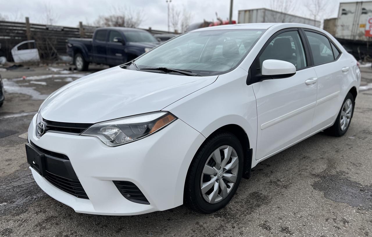 Just Arrived! White 2015 Toyota Corolla LE. ONE OWNER. NO ACCIDENTS. REGULARLY SERVICED AT TOYOTA DEALER! 216,338 KMS. 1.8 L. Great on gas and very reliable. Clean in and out. Runs well with no issues. Loaded with Backup Camera, Heated Seats, Keyless Entry, Bluetooth, CD/AUX/USB, Steering Wheel Audio and Phone Controls! <br/> <br/> <br/> *Safety Certified at no extra cost* <br/> <br/> <br/> *Welcome to get vehicle checked by any mechanic before purchase* <br/> <br/> <br/> All in price : $11,750 plus HST and Licensing. <br/> Call : 647-303-2585 or 647-631-8755 <br/> <br/> <br/> Brampton Auto Center <br/> 69 Eastern Avenue, Brampton ON, L6W 1X9. Unit 206 <br/> <br/> <br/> Brampton Auto Center, welcomes you! Family owned dealership located in the GTA. We take pride in our work. Customer service is our priority. Full disclosure with honesty. We are OMVIC registered and proud member of the UCDA. You are welcomed to get the vehicle checked by any mechanic before purchase, for quality assurance. Financing available for all types of credit! Good, bad or no credit. No problem! We will get you approved. Warranty options available for any year, make or model! Contact dealer for more details. <br/> E-mail : info@bramptonautocenter.ca <br/>