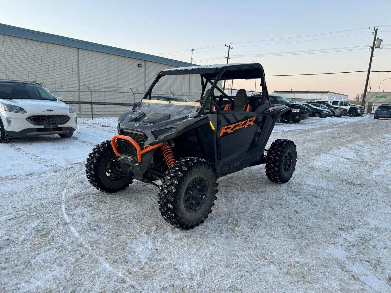 <h3><strong>Unleash Off-Road Dominance with the 2024 Polaris RZR XP 1000 Ultimate</strong></h3><p>The 2024 Polaris RZR XP 1000 Ultimate is built for riders who demand unparalleled power, precision, and comfort in their off-road adventures. Equipped with a 999cc ProStar engine delivering 114 horsepower, this side-by-side delivers blistering acceleration and exceptional performance across the most demanding trails. Whether youre carving through sand dunes, climbing rocky trails, or navigating dense forests, the RZR XP 1000 Ultimate is engineered to dominate.</p><p>&nbsp;</p><p>Featuring a highly responsive CVT transmission and an industry-leading suspension system with Walker Evans Velocity Series shocks, the RZR XP 1000 Ultimate offers 20.5 inches of usable travel and 14 inches of ground clearance. These components ensure a smooth, controlled ride over even the roughest terrain. The addition of 30-inch Maxxis Carnivore tires provides superior grip, durability, and confidence to tackle any off-road challenge.</p><h3>&nbsp;</h3><h3><strong>Premium Features for Comfort and Control</strong></h3><p>The 2024 RZR XP 1000 Ultimate delivers more than just raw power&mdash;it&rsquo;s packed with premium features for an exceptional riding experience. The fully enclosed Pro Armor cab includes contoured bucket seats, an intuitive 7-inch Ride Command touchscreen display, and integrated GPS for seamless navigation. With Bluetooth connectivity, Rockford Fosgate audio, and multiple storage compartments, this machine is designed for comfort and convenience on every adventure.</p><h3>&nbsp;</h3><h3><strong>Flexible Financing & Nationwide Delivery</strong></h3><p>Get behind the wheel of the 2024 Polaris RZR XP 1000 Ultimate with our flexible financing options tailored to your budget. Plus, take advantage of fast, nationwide delivery to get your machine ready for the trail without delay. Don&rsquo;t wait to experience the pinnacle of off-road performance&mdash;contact us today to learn more or schedule your test ride!</p>