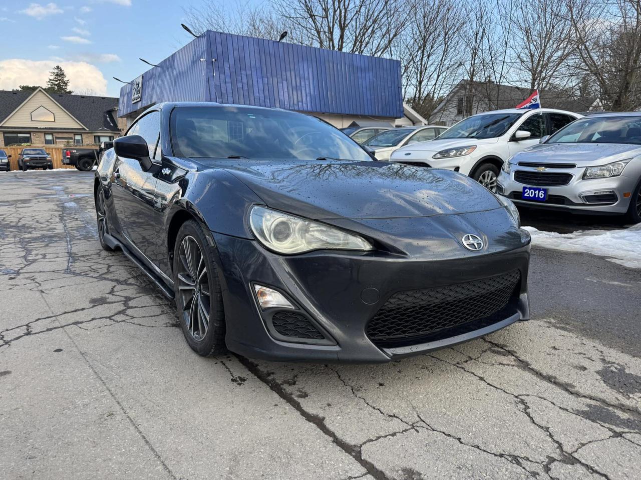 <p>Looking for a sporty coupe thats fun to drive? Check out this pre-owned 2013 Scion FR-S, available now at Mallory Auto! This sleek gray coupe with a black interior is sure to turn heads. With its rear-wheel drive and automatic transmission, this Scion FR-S offers a dynamic driving experience. Under the hood, youll find a responsive 2L 4-cylinder engine, perfect for those weekend getaways or daily commutes. This vehicle has been well-maintained and has 217,340km on the odometer.</p><p>This Scion FR-S is all about the driving experience. Heres a taste of what it offers:</p><ul><li><strong>Agile Handling:</strong> Experience the thrill of a car designed for spirited driving, with precise steering and a balanced chassis.</li><li><strong>Sporty Coupe Design:</strong> The FR-Ss low profile and aerodynamic lines make a bold statement on the road.</li><li><strong>Fuel Efficiency:</strong> Enjoy great gas mileage without sacrificing performance.</li><li><strong>Driver-Focused Interior:</strong> The black interior keeps the driver in mind, with supportive seats and a layout designed for optimal control.</li><li><strong>Rear-Wheel Drive Thrills:</strong> Experience the classic sports car feel with the performance of rear-wheel drive.</li></ul><p>Visit Mallory Auto today to take this 2013 Scion FR-S for a test drive and feel the excitement for yourself!</p><p><strong><em>Powered by AutoIntelligence&trade;</em></strong> Vehicle information has been generated using artificial intelligence and is provided for informational purposes only. While efforts are made to ensure accuracy, please confirm all details directly with the dealer.</p>