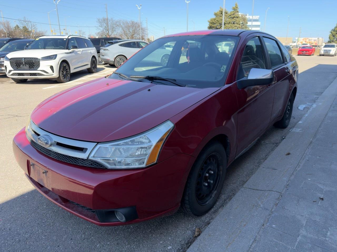 2010 Ford Focus SANGRIA RED METALLIC | CHARCOAL BLACK CLOTH SEAT TRIM | 2.0L DOHC I4 DURATEC ENG | 4-SPEED A/T W/OD Photo