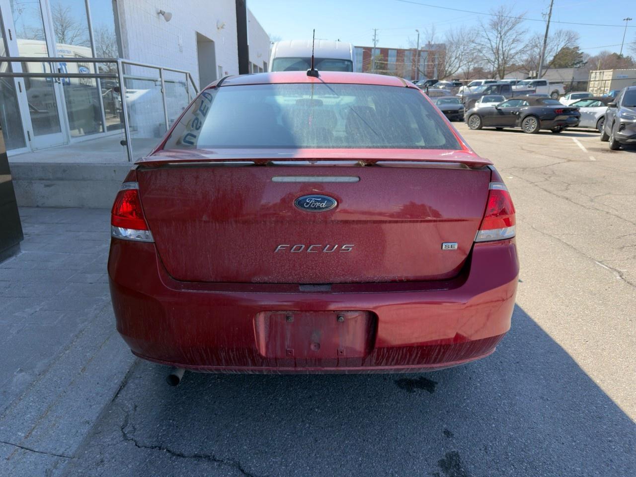 2010 Ford Focus SANGRIA RED METALLIC | CHARCOAL BLACK CLOTH SEAT TRIM | 2.0L DOHC I4 DURATEC ENG | 4-SPEED A/T W/OD Photo