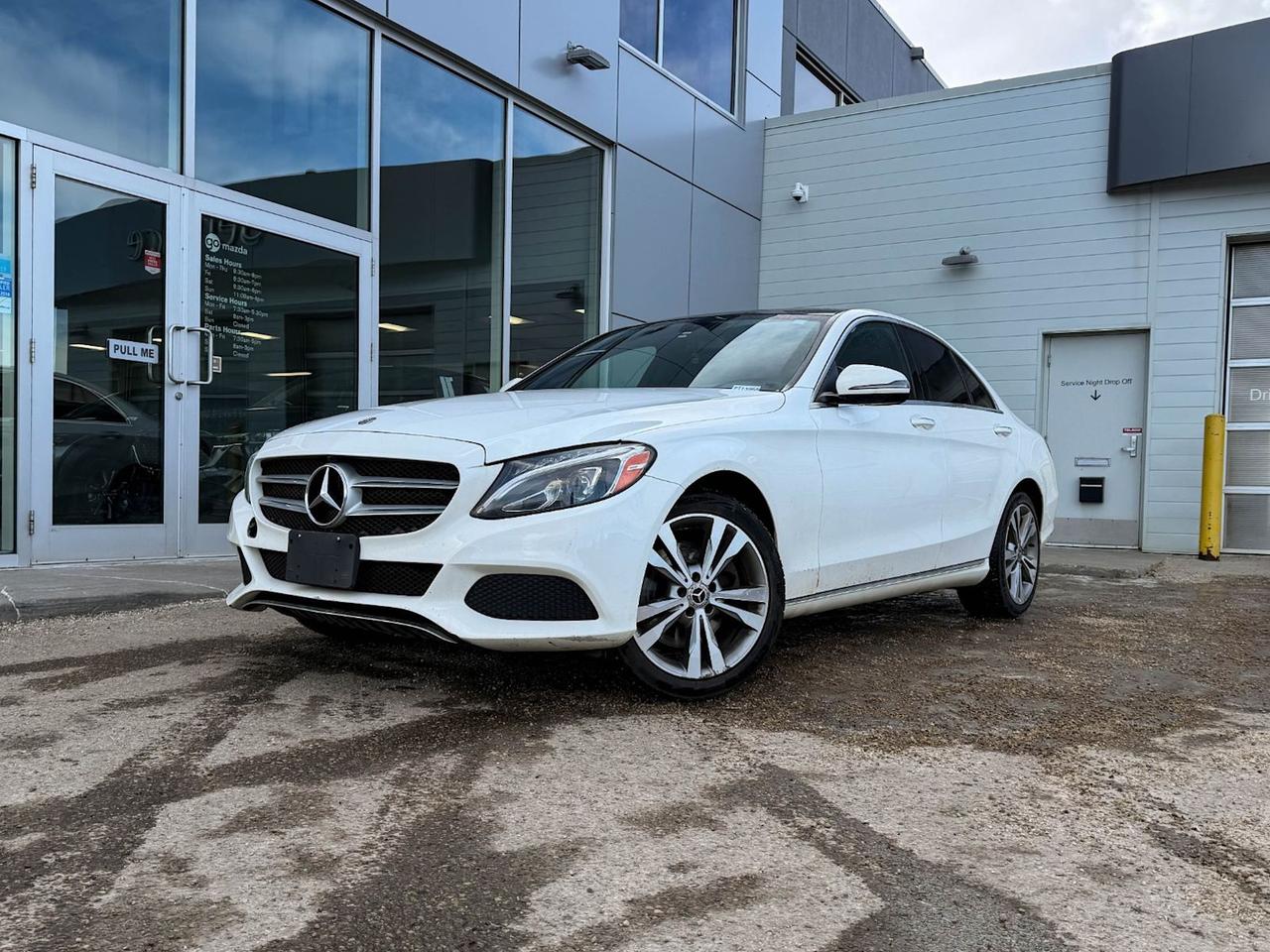 Experience luxury and performance with this pre-owned 2018 Mercedes-Benz C-Class C 300 4MATIC Sedan in elegant White. Powered by a responsive 2.0L turbocharged engine paired with a smooth 9G-TRONIC automatic transmission, this AWD beauty offers confident handling in all conditions.Step inside to heated ARTICO leatherette seats with 8-way power adjustments and memory settings for personalized comfort. Stay connected with the Audio 20 system featuring Bluetooth, CD player, and steering wheel controls, all complemented by a sophisticated aluminum and piano black interior trim.Safety is paramount with 7 airbags, stability and traction control, automatic suspension ride control, and advanced driver aids like forward collision mitigation and driver attention alert. Enjoy convenience with dual-zone climate control, power sunroof, power-folding mirrors, and keyless entry.Drive with confidence and stylecontact Go Mazda today to schedule a test drive and take home this refined and feature-packed Mercedes-Benz C 300 4MATIC.Go Mazda is an AMVIC licensed business.This vehicle has been registered in the province ofBritish Columbia and Ontario, and is showing a CarFax incident with no reported amount.