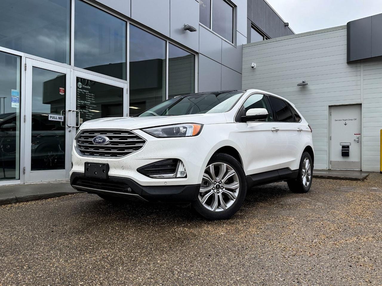 Experience versatility and style with this pre-owned 2023 Ford Edge Titanium AWD in striking White. Powered by the efficient Twin-Scroll 2.0L EcoBoost engine paired with an 8-speed automatic transmission, this SUV delivers confident performance with smooth handling. Enjoy premium comfort with ActiveX-trimmed sport bucket seats, heated front seating, and dual-zone automatic climate control.Stay connected and entertained thanks to SYNC 4A with enhanced voice recognition, a 12-inch touchscreen with navigation, 12 speakers, wireless charging, and smart device mirroring. Safety is comprehensive with blind spot warning, lane departure prevention, forward collision mitigation, and a rearview camera.With all-wheel drive and advanced suspension systems, the Ford Edge Titanium offers stability and control no matter the road conditions. Additional features include a power liftgate, LED headlights, remote start, keyless entry with push-button ignition, and multiple USB ports for convenience.This well-equipped SUV combines technology, comfort, and safety to elevate your driving experience. Contact us today to schedule a test drive and make this 2023 Ford Edge Titanium AWD yours!Go Mazda is an AMVIC licensed businessThis vehicle has been registered in the province ofBritish Columbia and was previously used as Fleet.