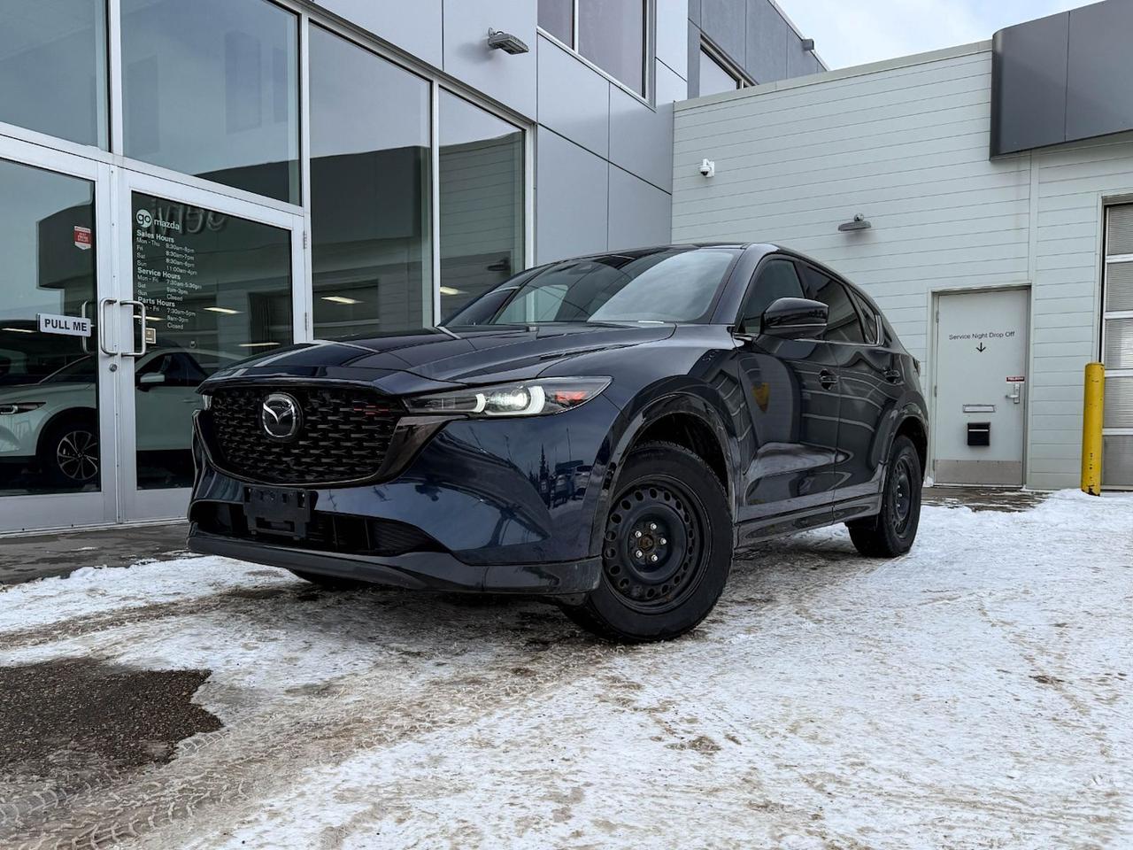 Experience refined driving with this pre-owned 2022 Mazda CX-5 GT AWD in stunning Blue. Powered by a 2.5L SKYACTIV-G engine paired with a smooth 6-speed automatic transmission and full-time AWD, it offers confident handling in all conditions. Enjoy premium comfort with heated and ventilated leather front seats, dual-zone climate control, and a power-adjustable driver seat. Stay connected and entertained via the integrated navigation system and Bose premium sound. Advanced safety features like blind spot monitoring, lane departure prevention, and pedestrian impact prevention provide peace of mind. Finished with sleek 19 black metallic alloy wheels and a modern, sophisticated design, this CX-5 GT combines style, technology, and versatility perfectly. Visit Go Mazda today to test drive and make it yours!Go Mazda is an AMVIC licensed business.This vehicle has been registered in the province ofOntario